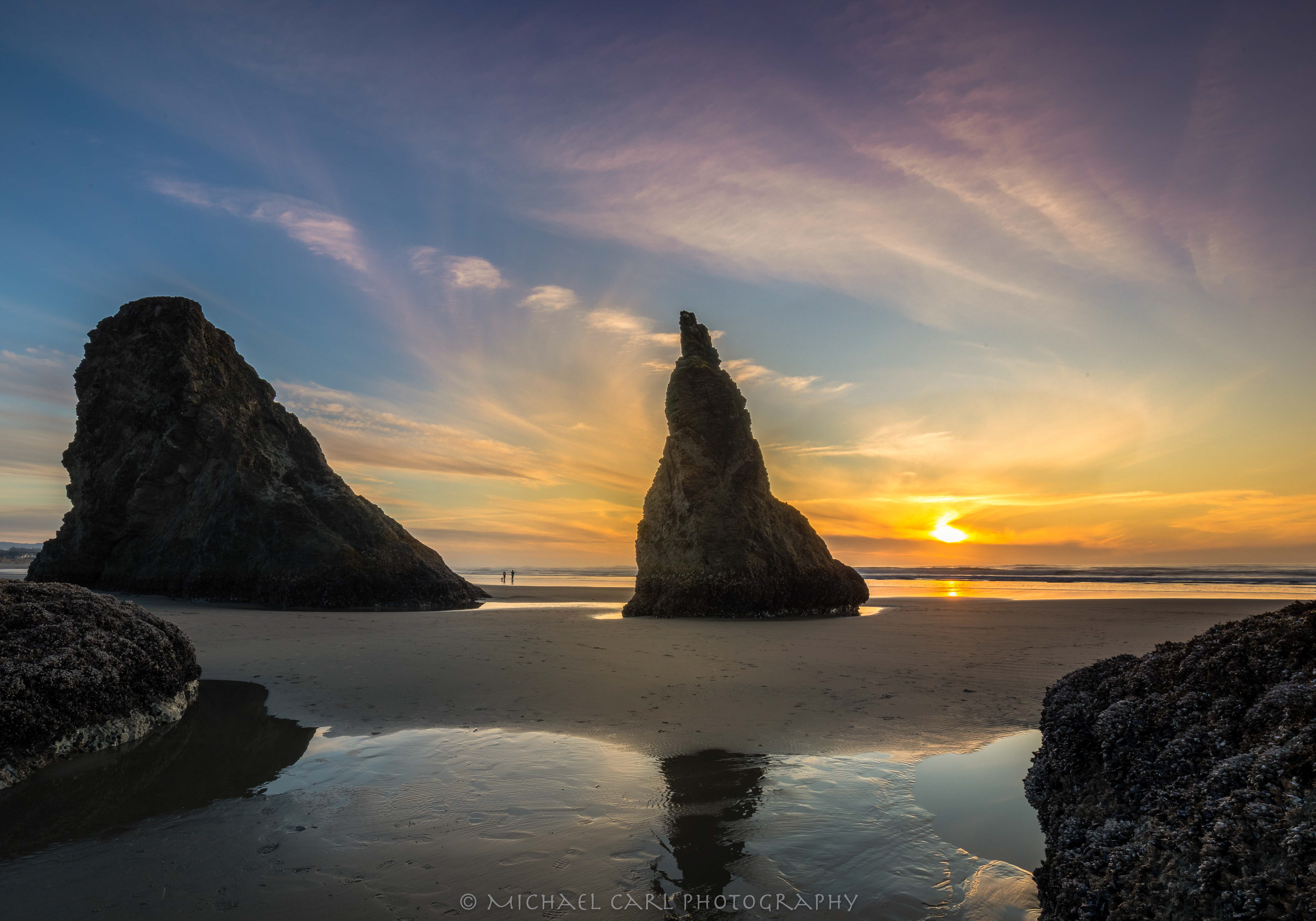Oregon Coast photography of sunset along the pyramid shaped sea stacks of Bandon Beach.