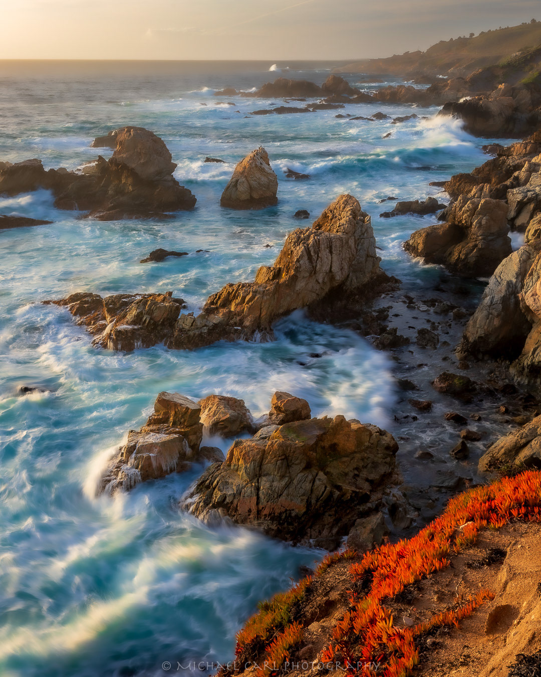 Golden light strikes the rugged sea stacks along the Big Sur Coast of California