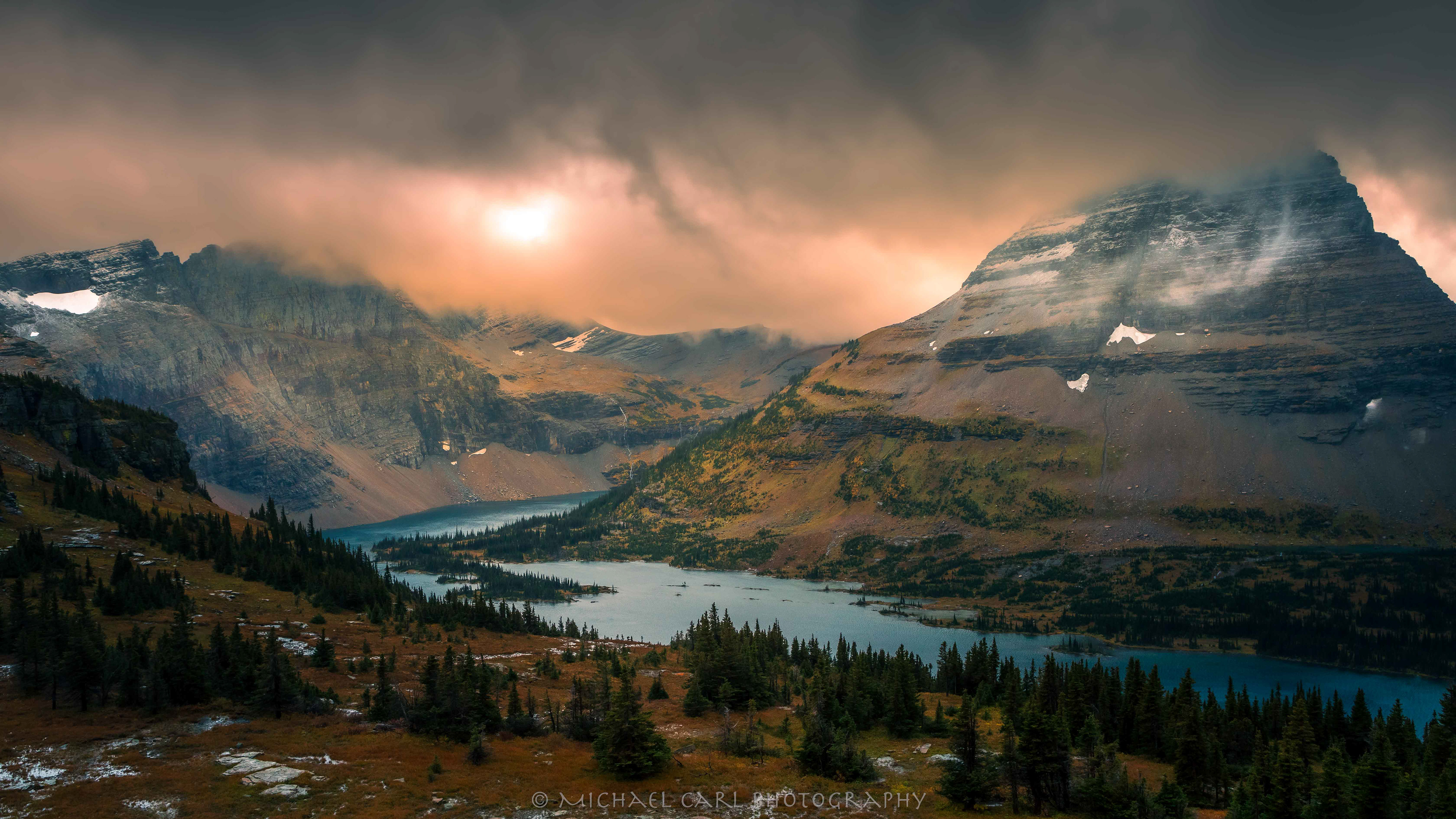 A storm sweeps over Bearhat Mountain sitting above Hidden Lake in Glacier National Park.