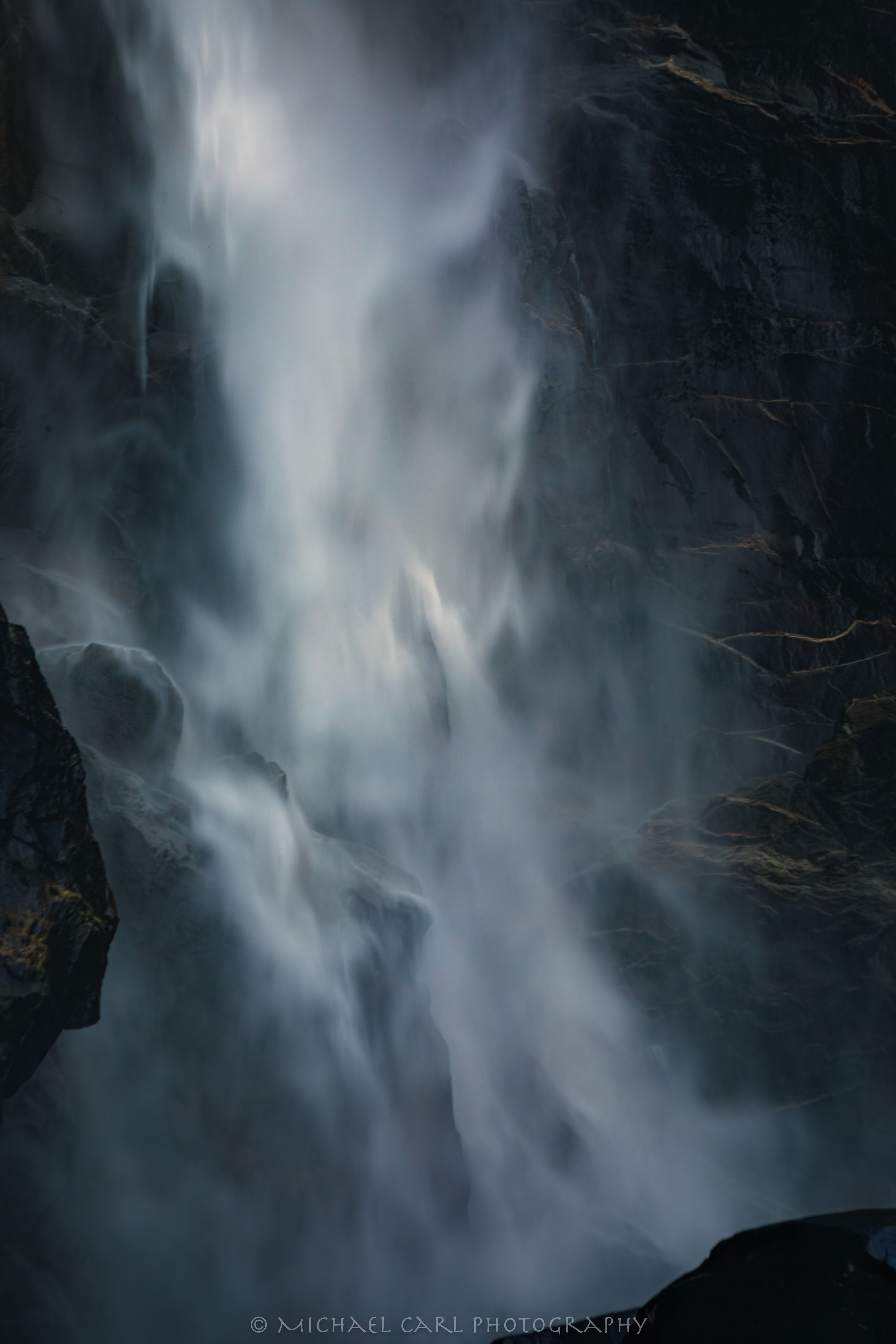 Waterscape photography using telephoto lens to capture details of waterfall in Yosemite National Park.