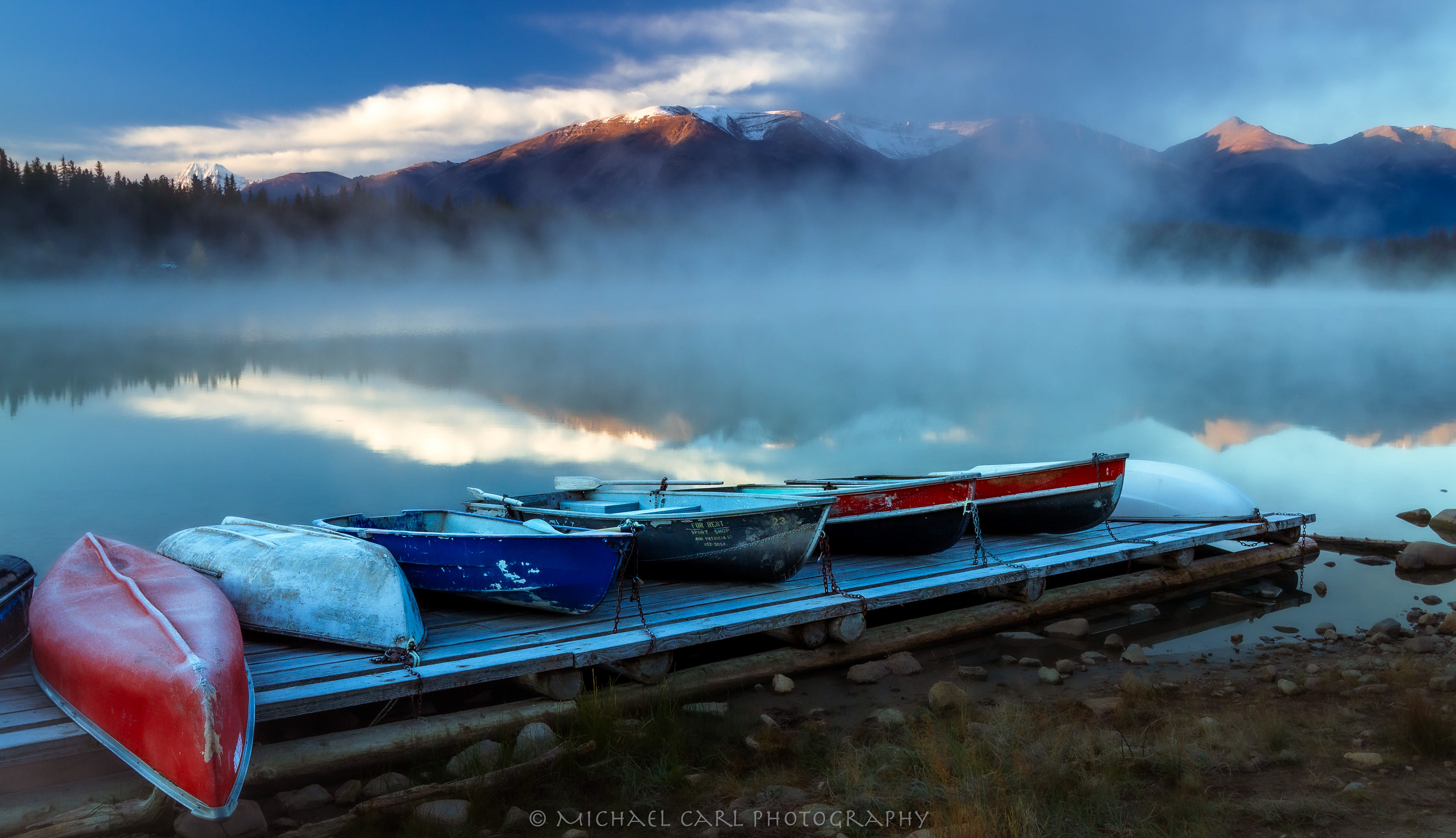 Landscape photography of mountains reflected on Pyramid Lake in Jasper National Park