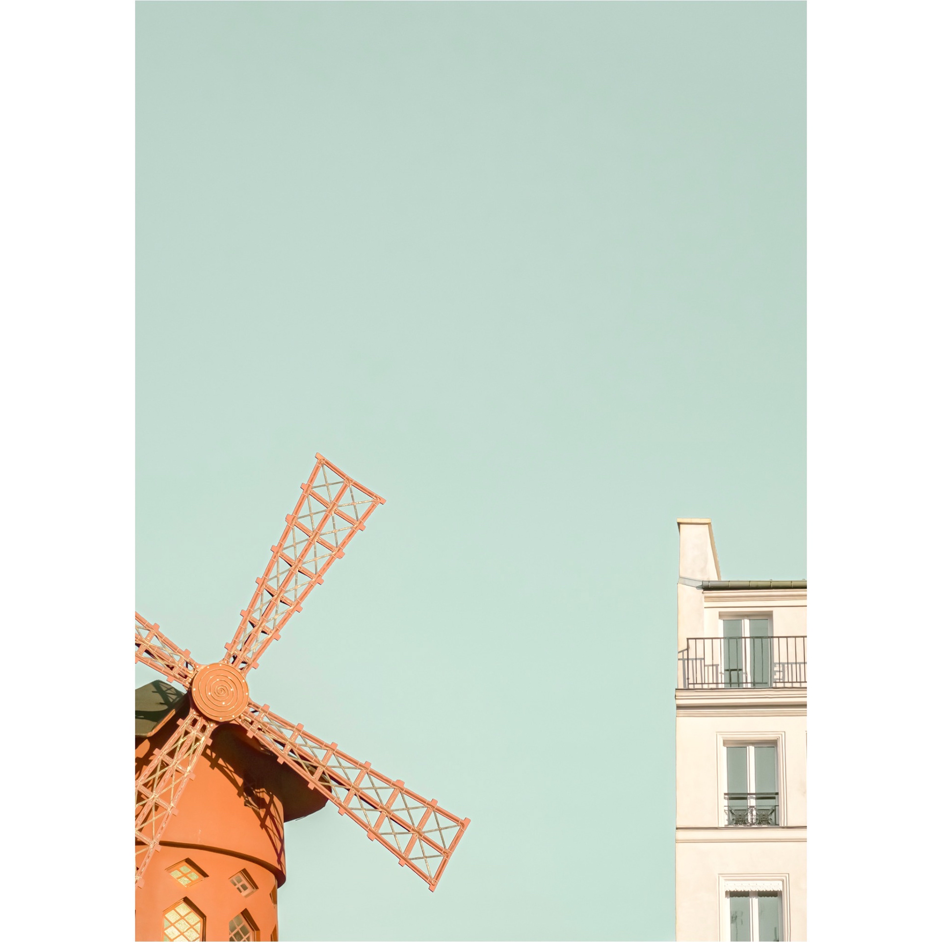 Minimal photograph of the famous Moulin Rouge Cabaret next to a typical Parisian facade.Retro postcard look and popping colors.Paris, France