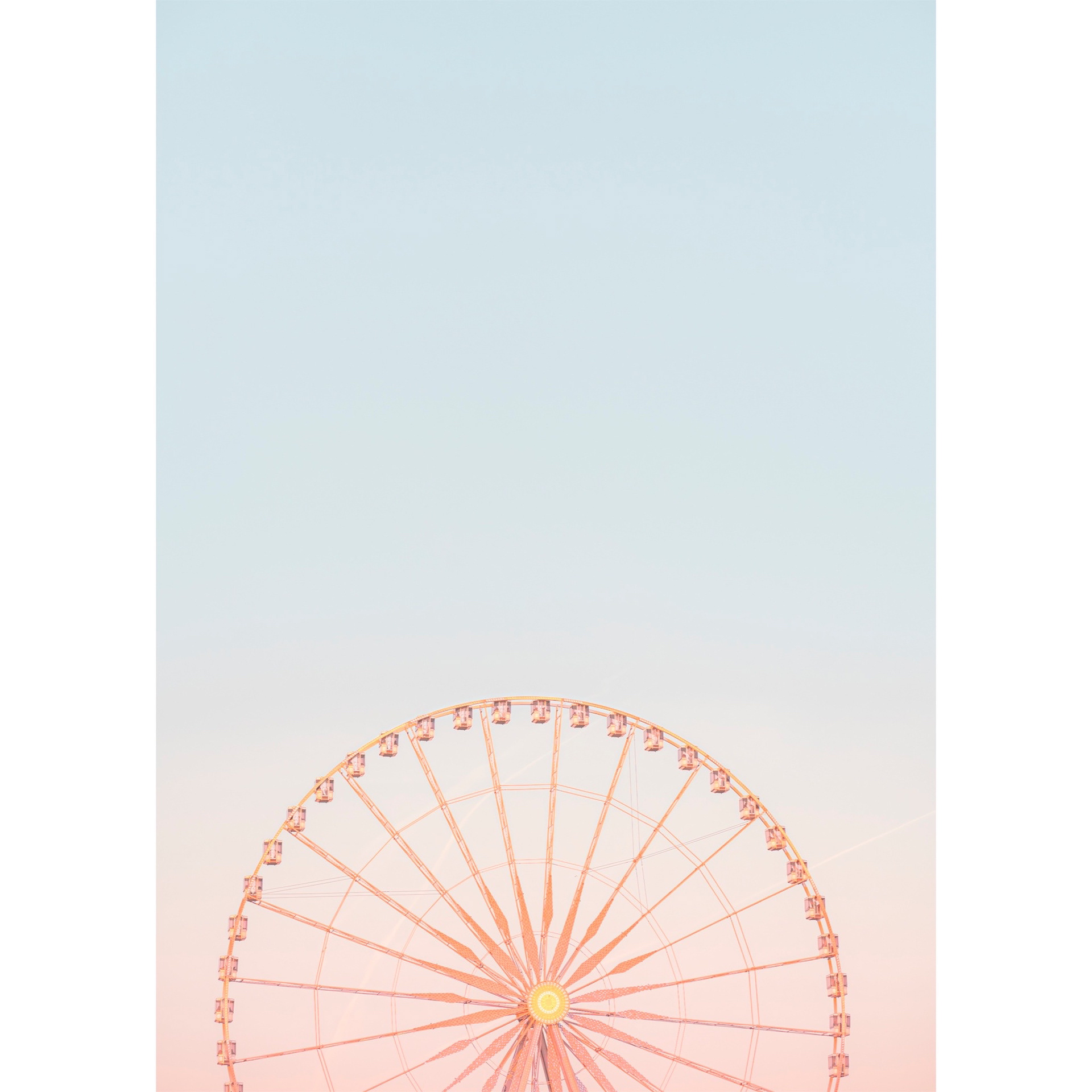 Minimalistic Ferris Wheel in the Tuileries Gardens on a blurred pastel sky at sunset. Pink to blue gradient of colors. Paris, France