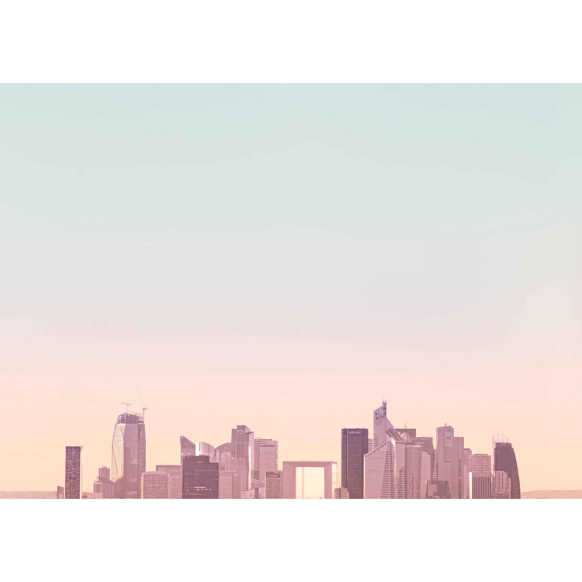 Panoramic skyline in Paris. Minimal photograph with soft and warm sunset colors that invites you to see Paris from a different perspective.