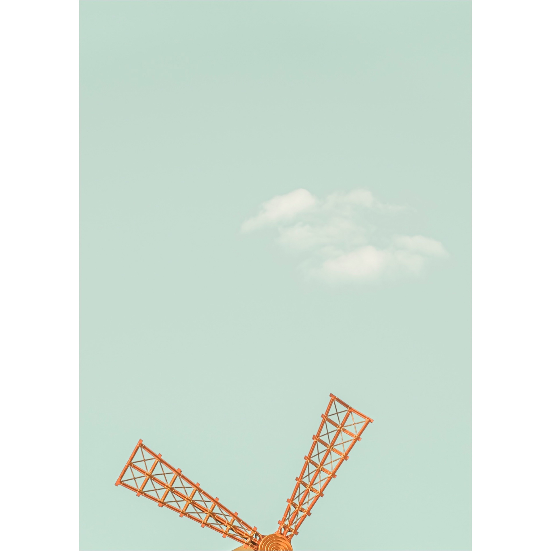 Details of the symbolic wings of the Moulin Rouge Cabaret and a tiny cloud. Minimalistic and colorful picture with a poetic look. Paris