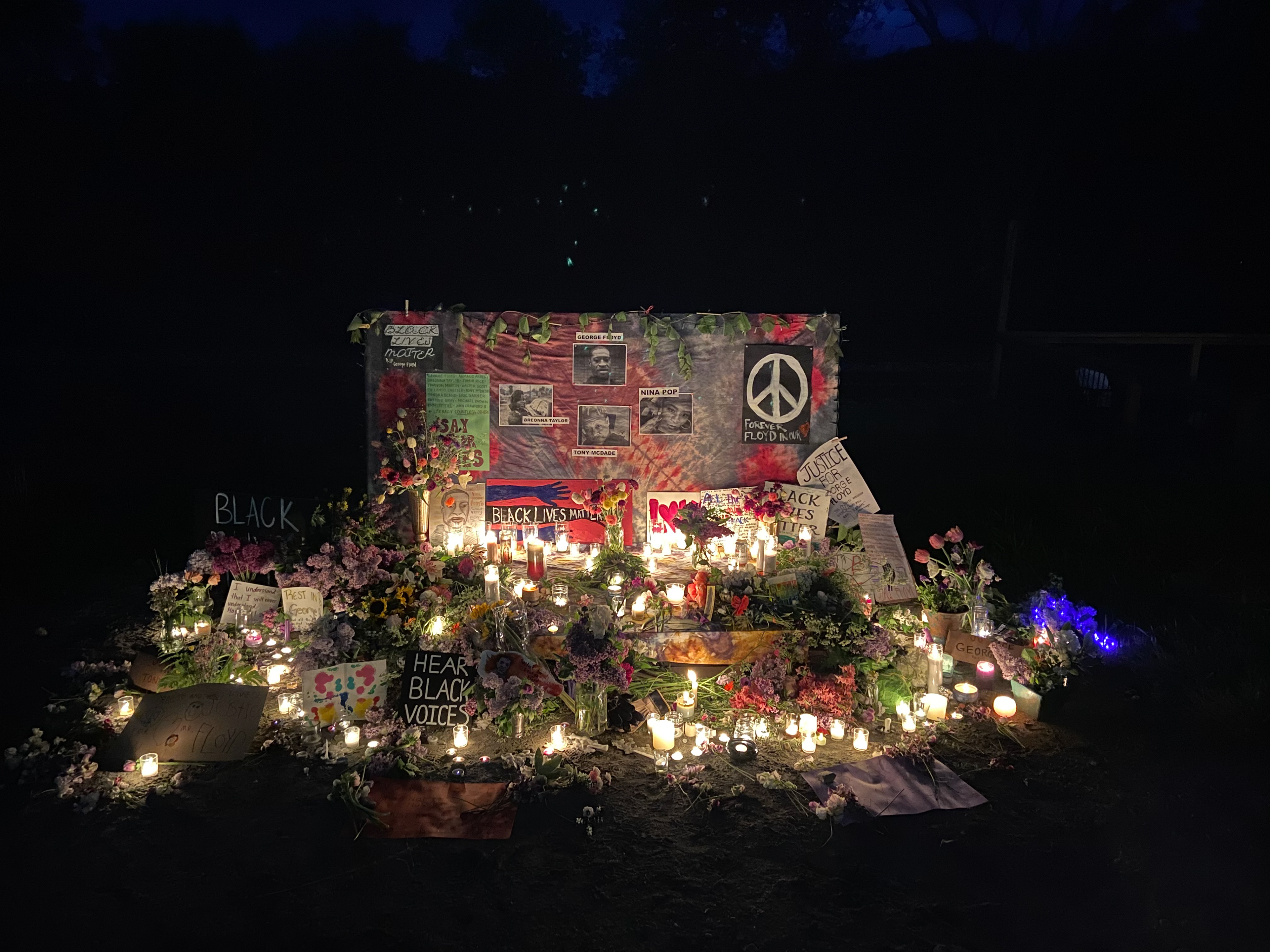 Posters and photographs dedicated to Black people killed by police.