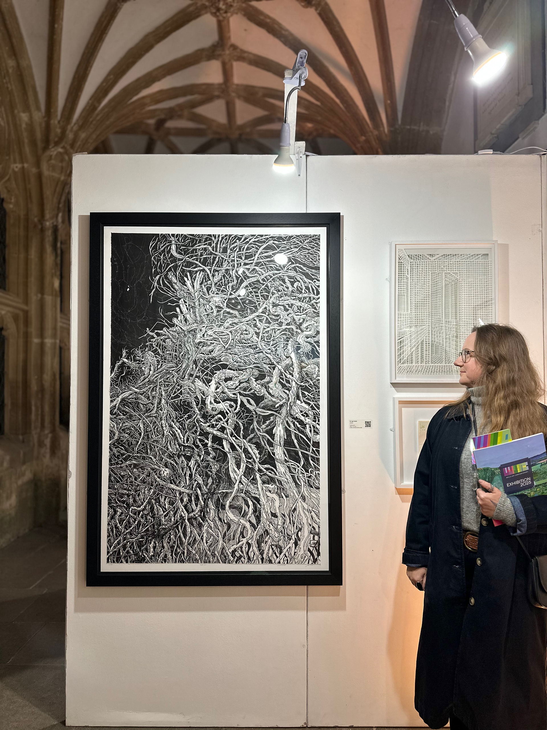 “Aga Kubish, Habitat linocut print installed in the cloisters, Wells Art Contemporary 2025