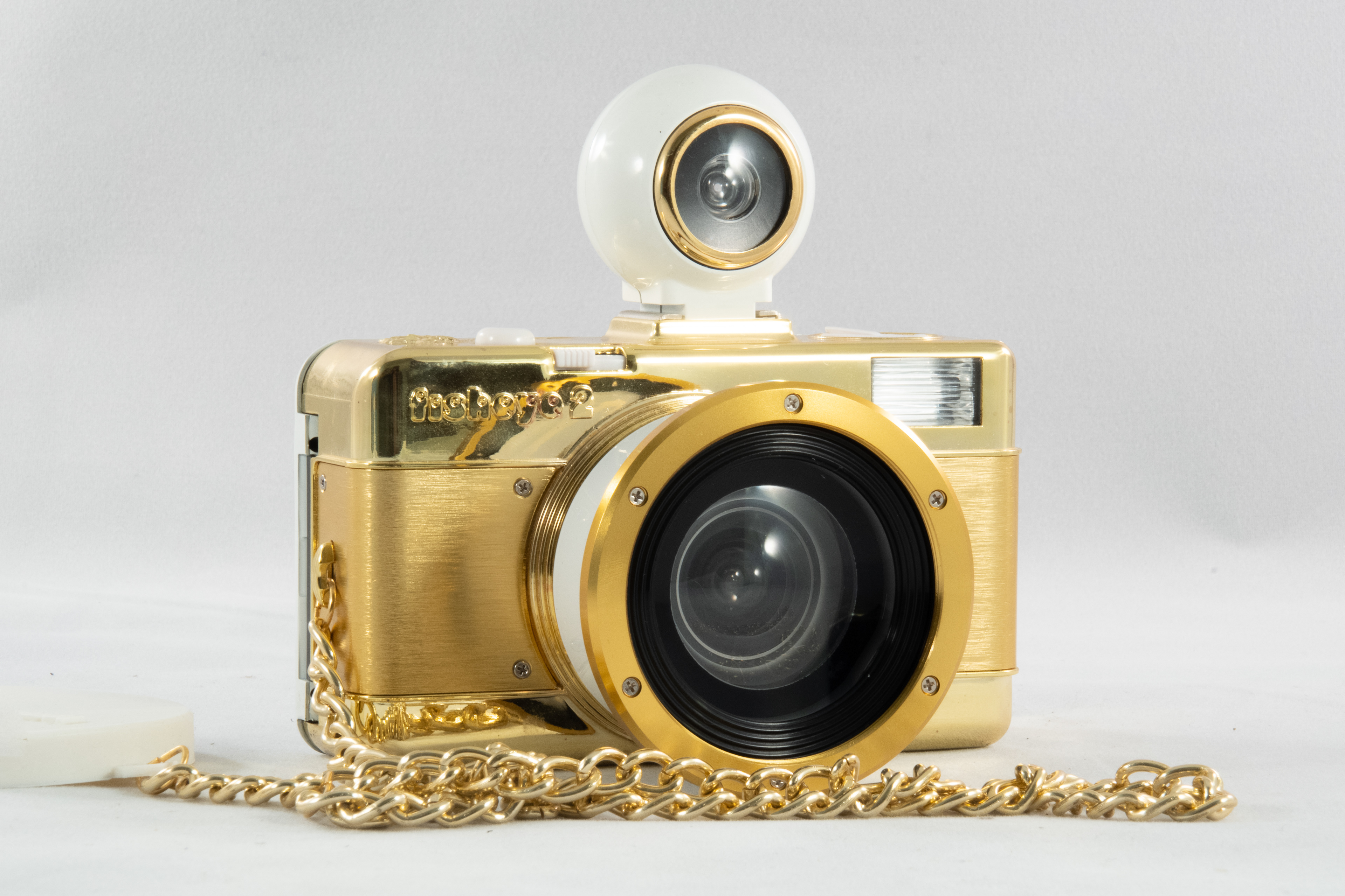2012 - Lomography Fisheye 2 Gold - Features a plastic 10mm fisheye lens Fxed f/8 aperture  For producing a distorted circular image Comes with a removable fisheye viewfinder
