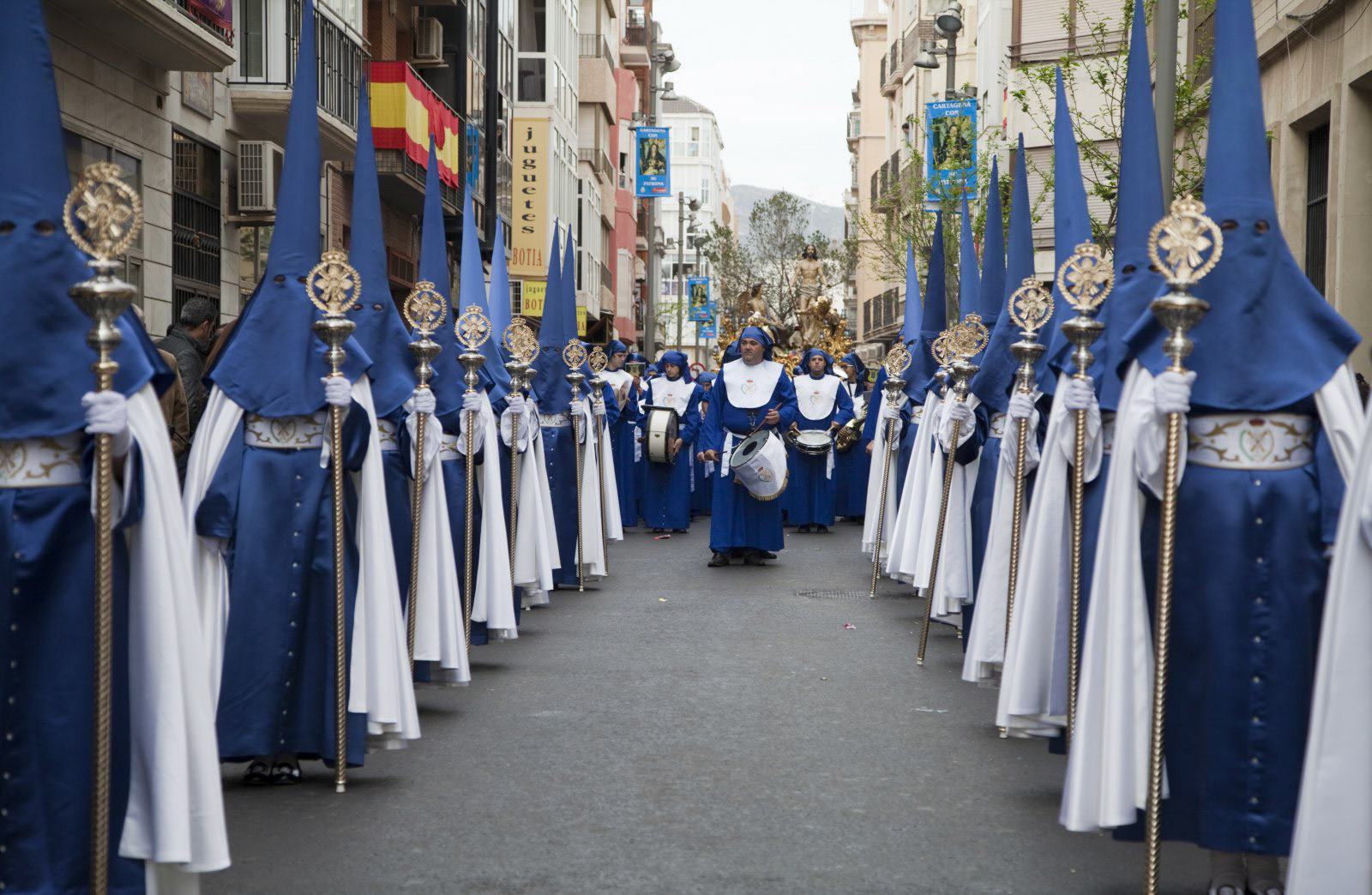 Nazarenos in procession during Semana Santa (Holy Week) in Cartagena, Spain