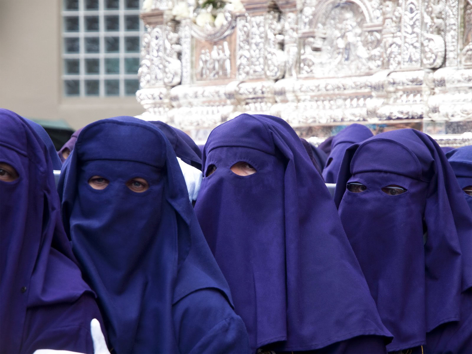 Costaleros bearing a Trono during Semana Santa in Malaga, Spain