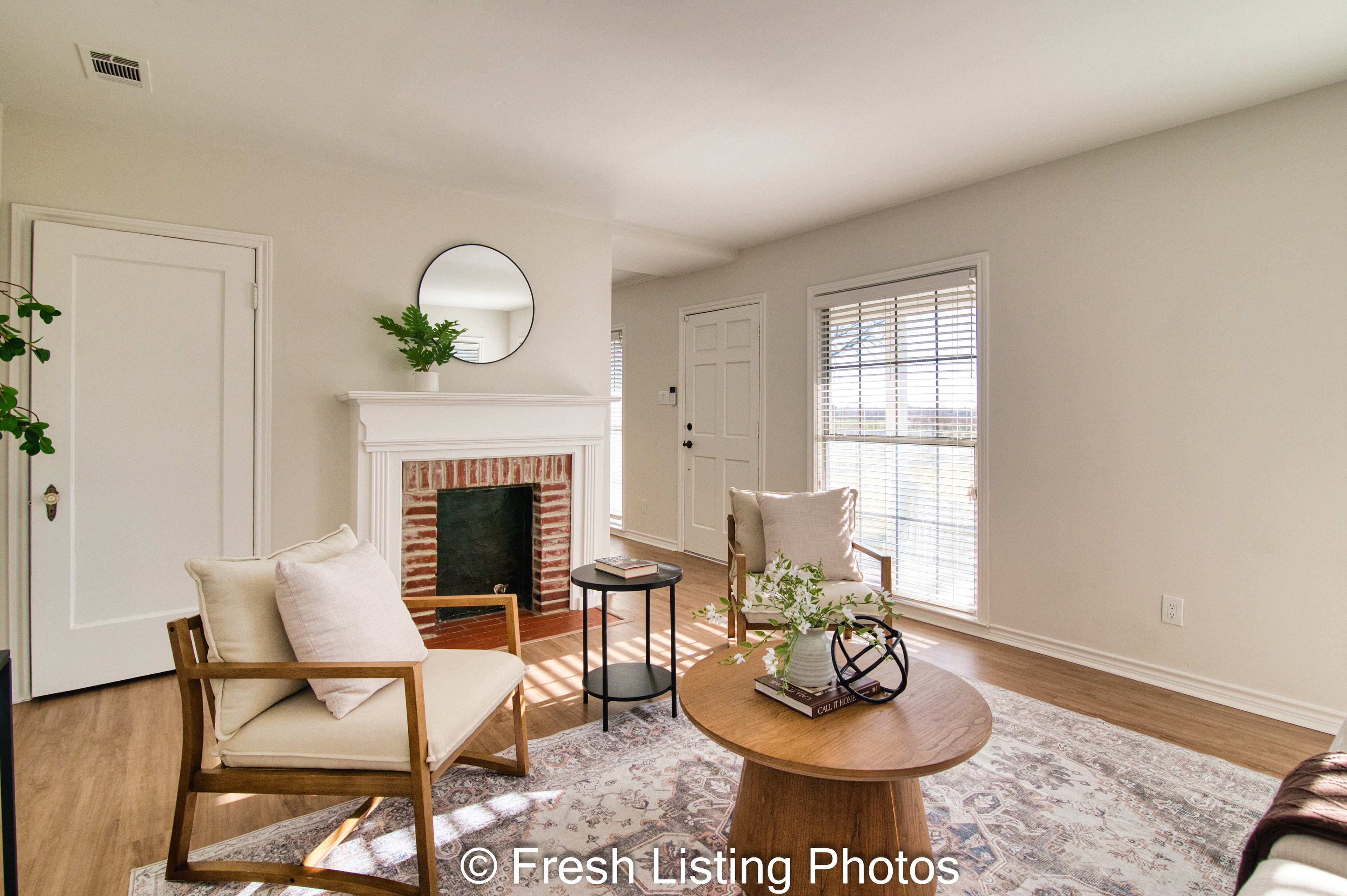 furnished family room with fireplace and front door