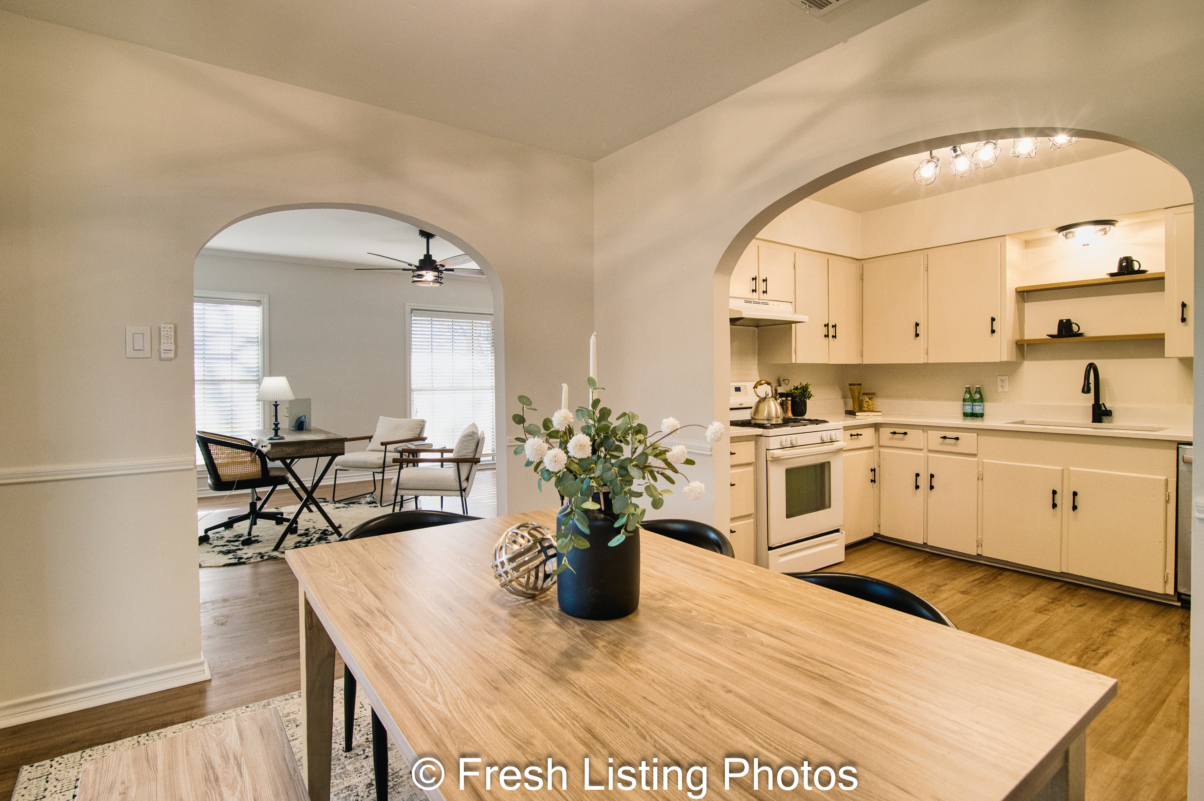 Furnished dining room with living room and kitchen