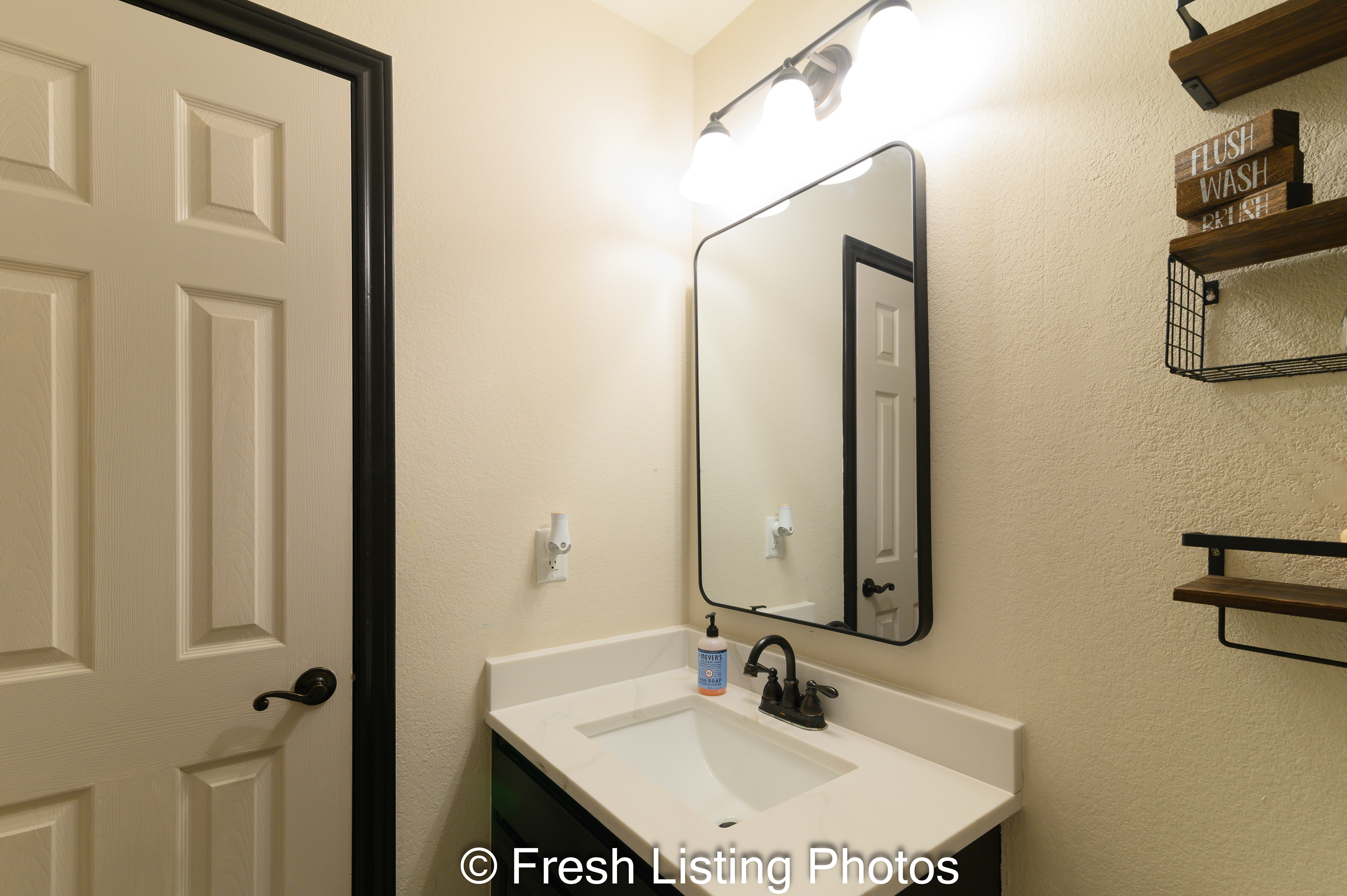 Bathroom with vanity and closet