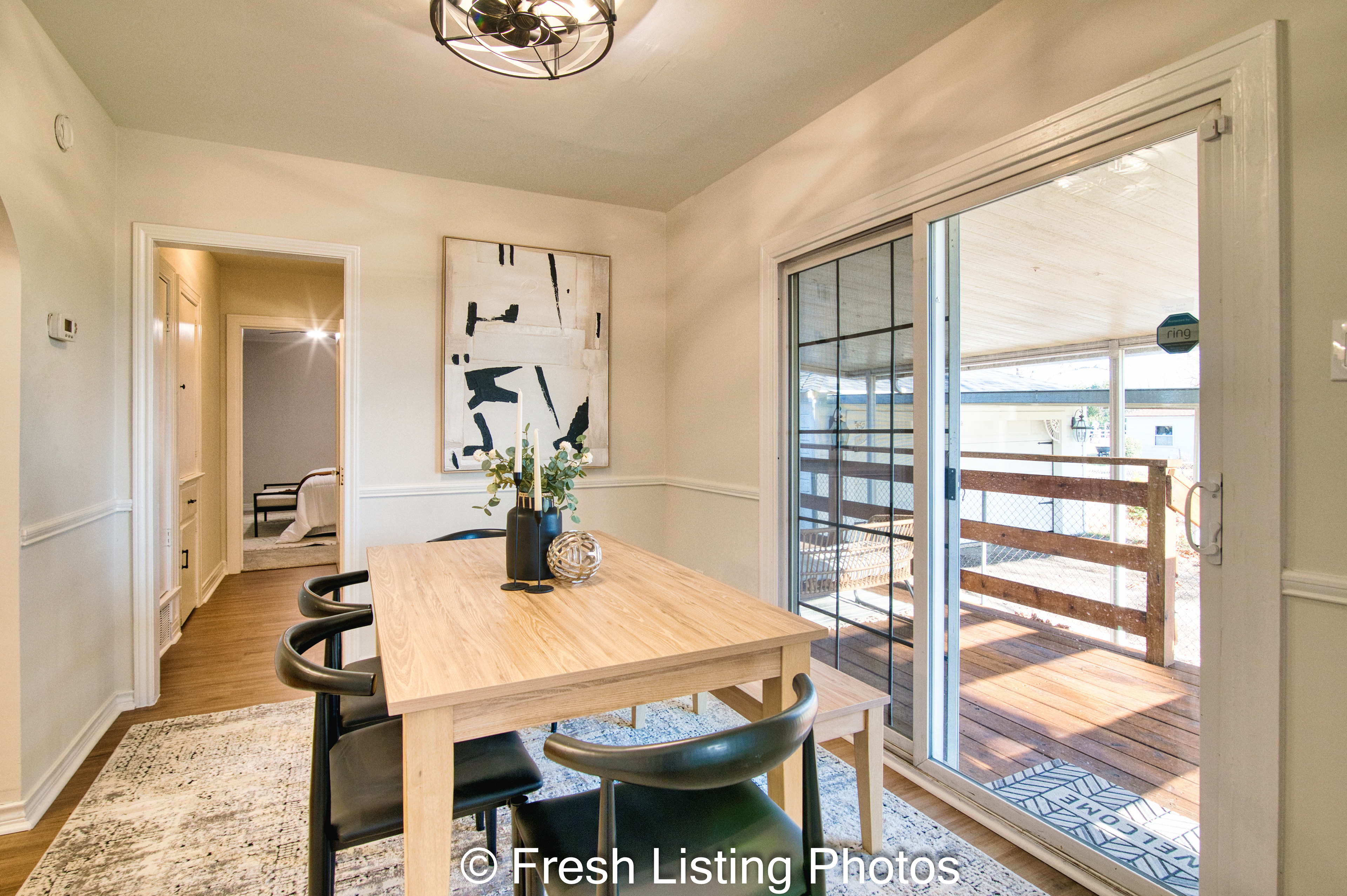Furnished dining room with patio view