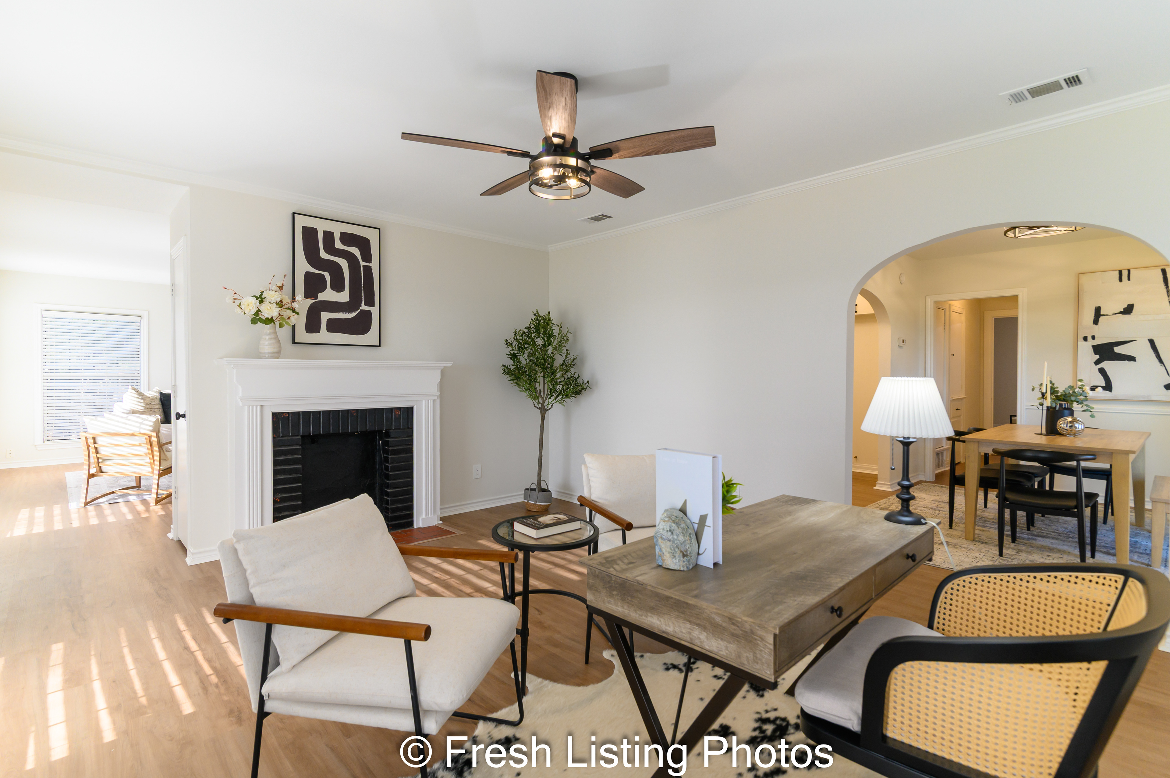 Family room with double sided fireplace and dining