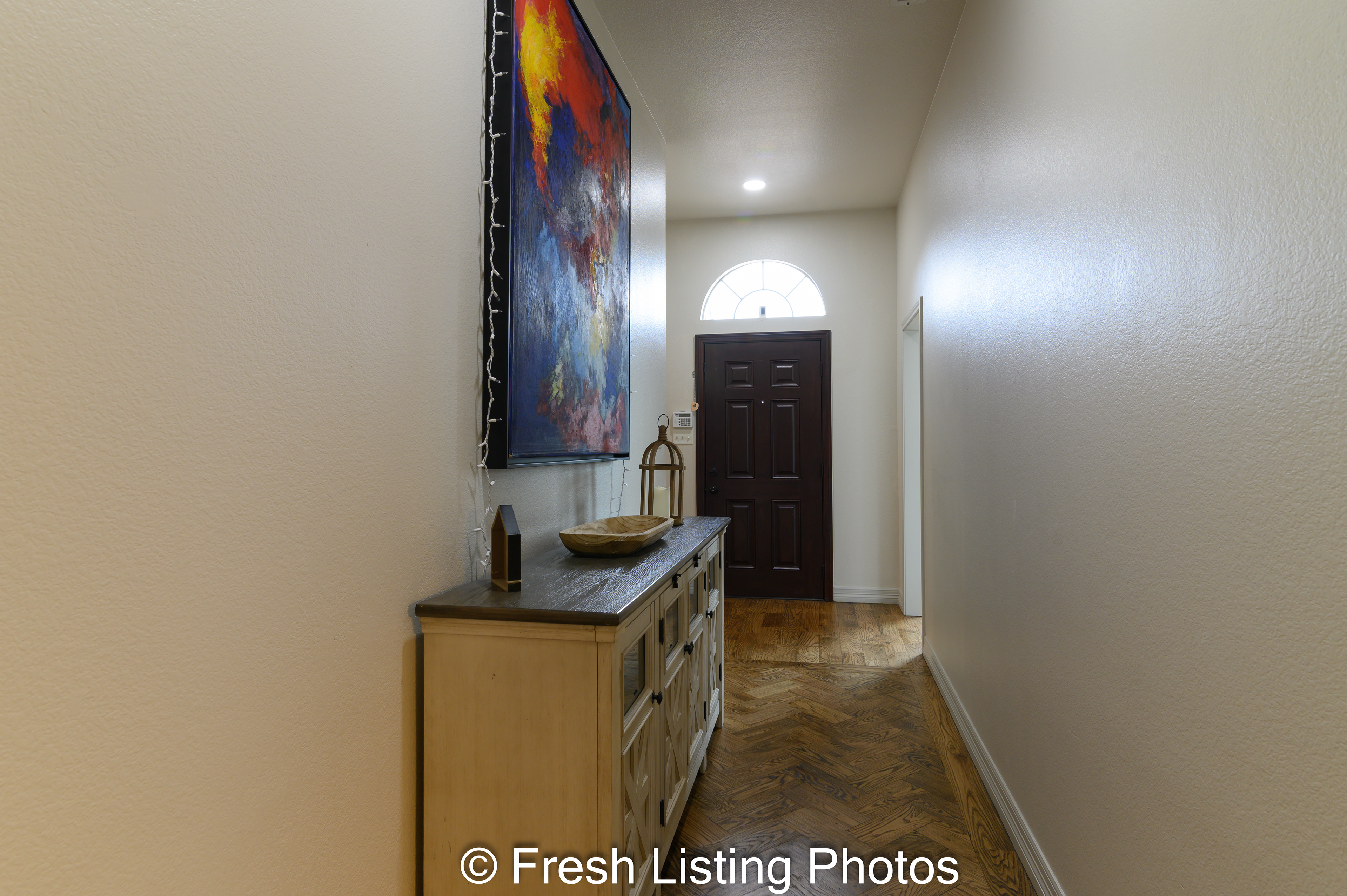 Entryway with access to bedrooms, living and kitchen