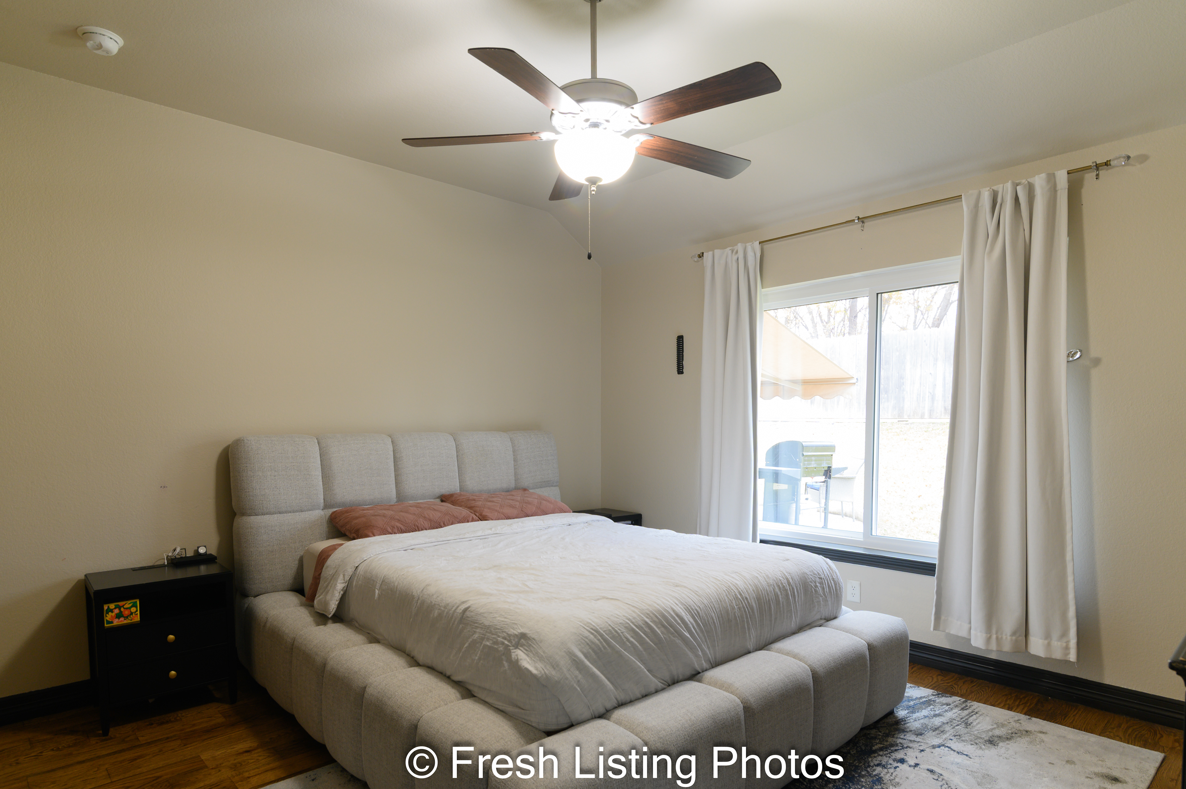Primary bedroom with view of the patio