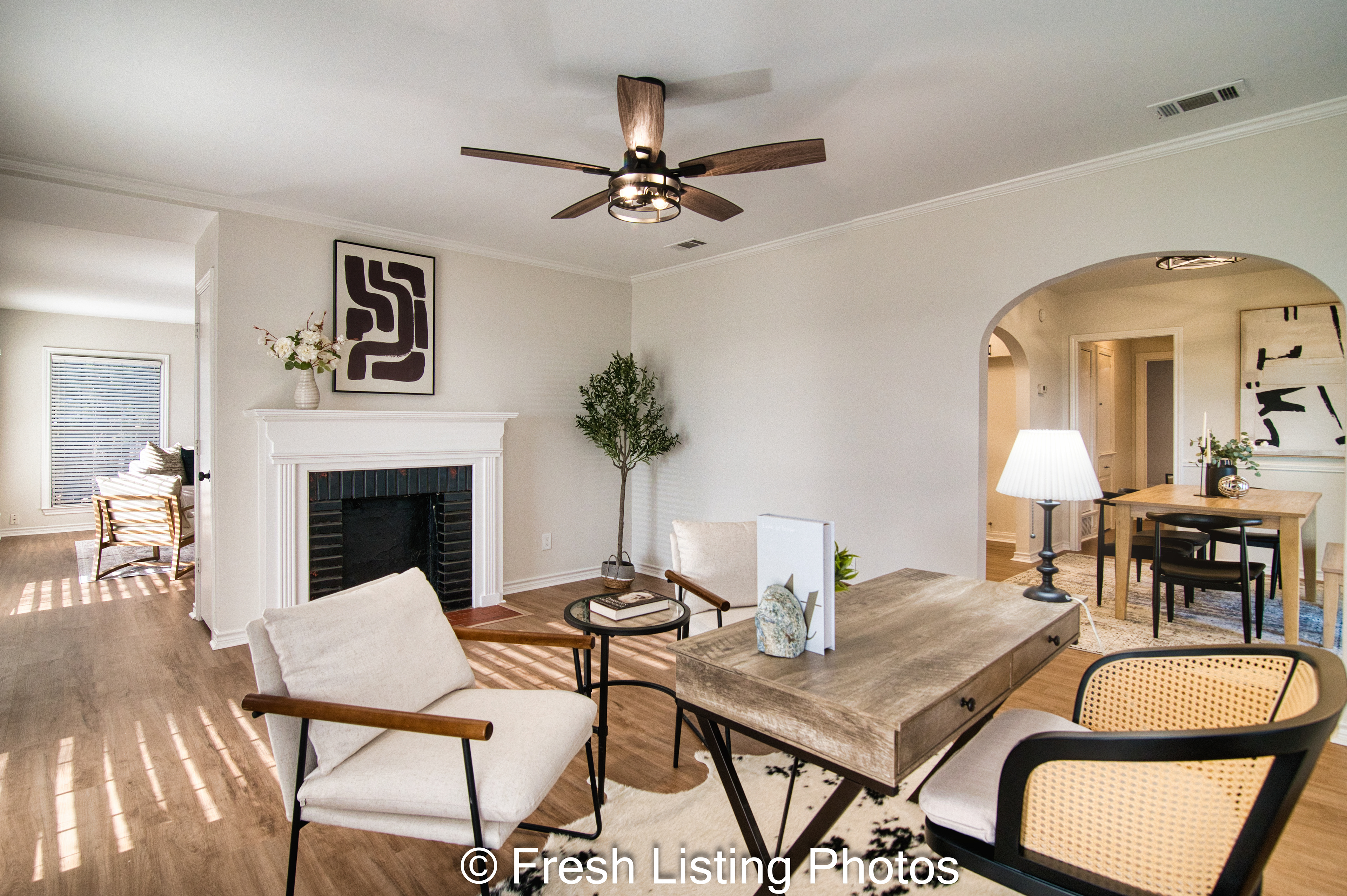 Furnished living room with dual-sided fireplace