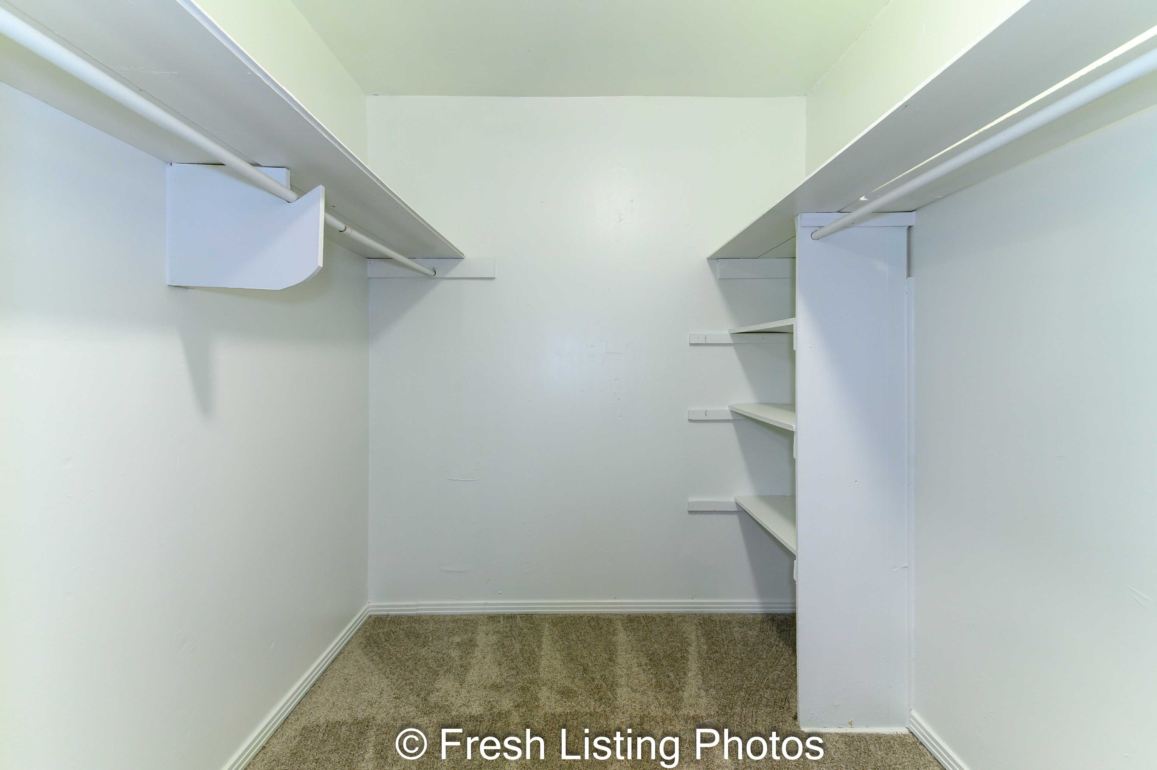 Walk in closet with shelving