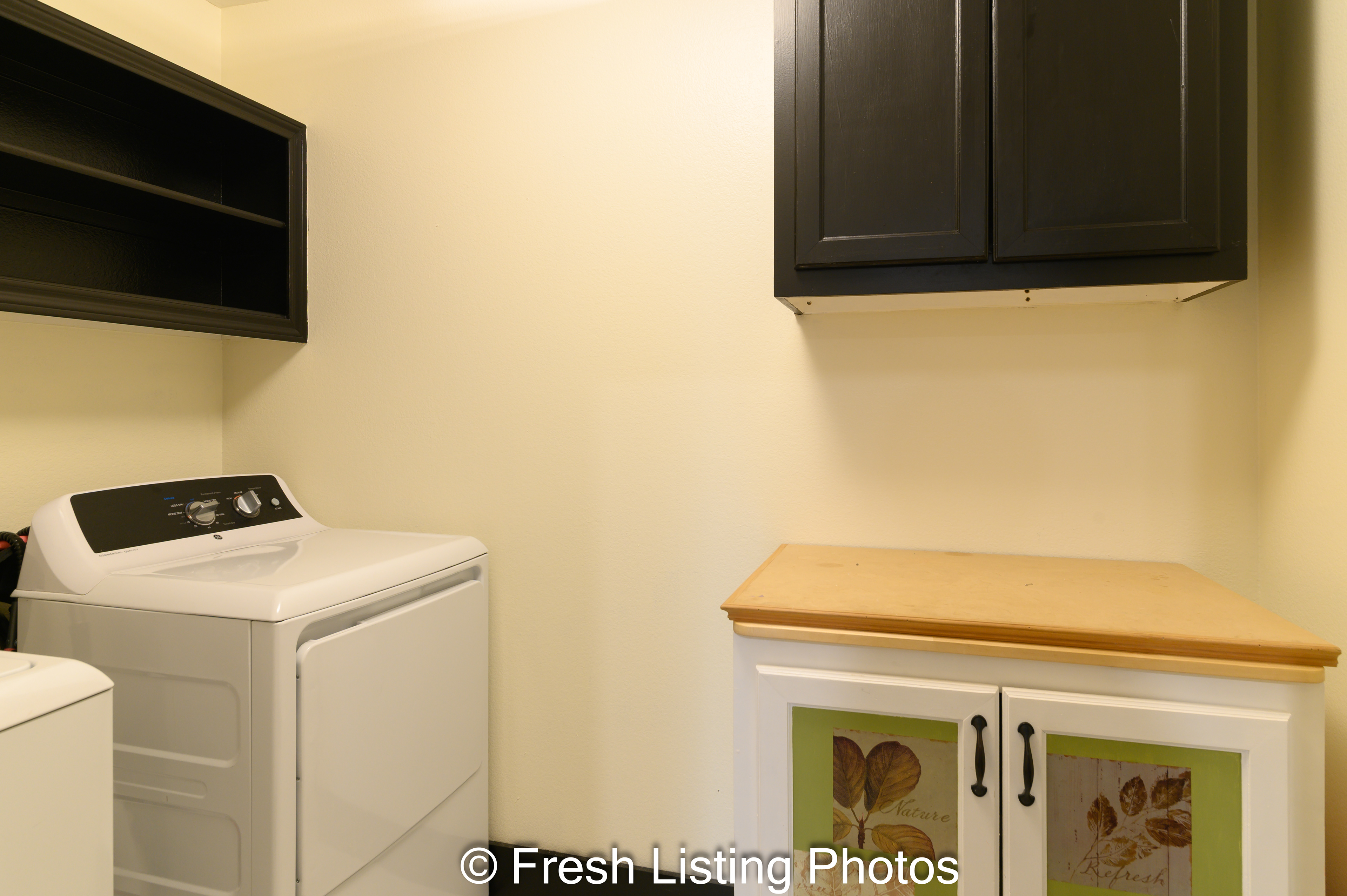 Laundry room with counter and shelving