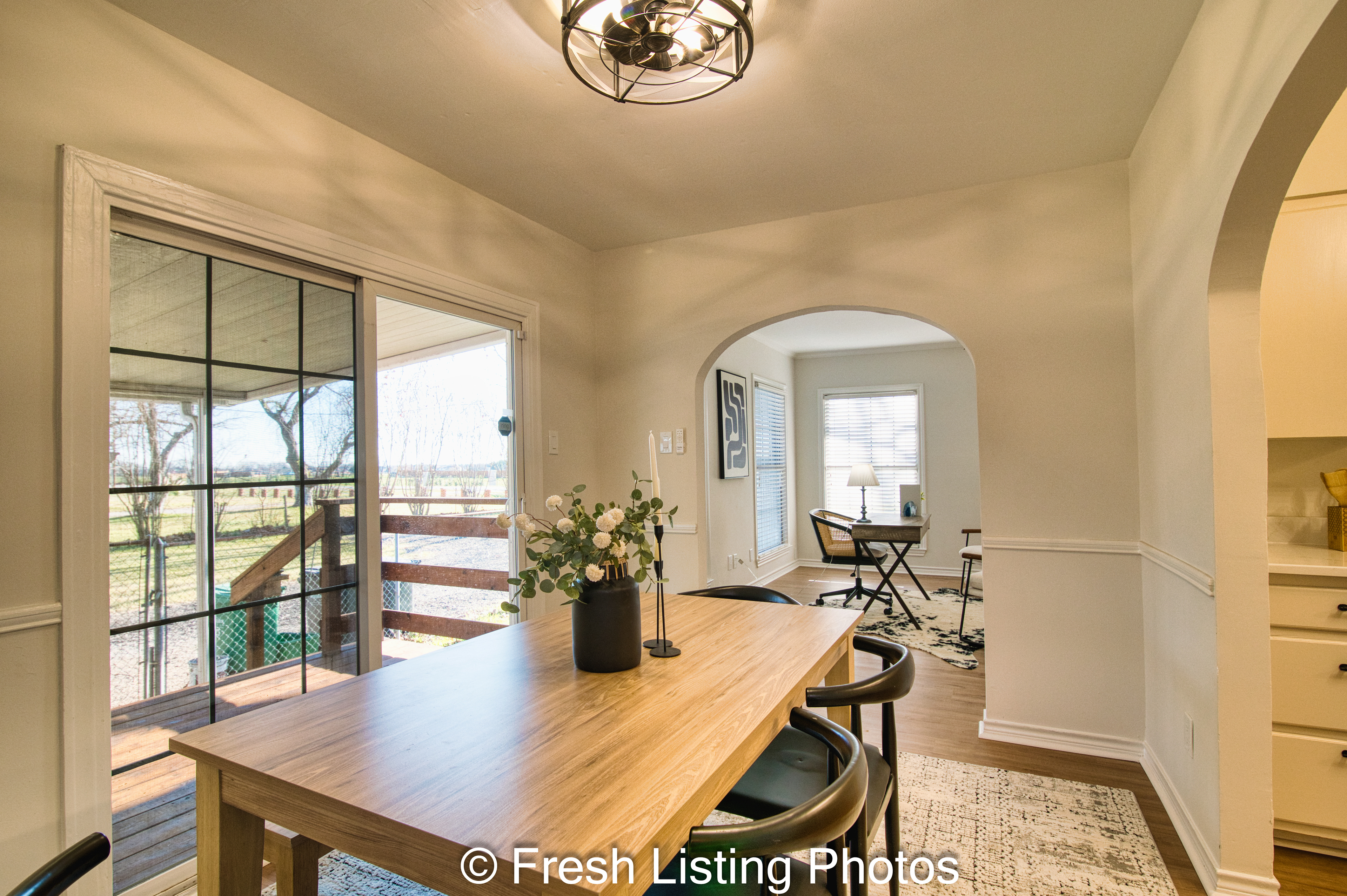 Dining room with living room and patio