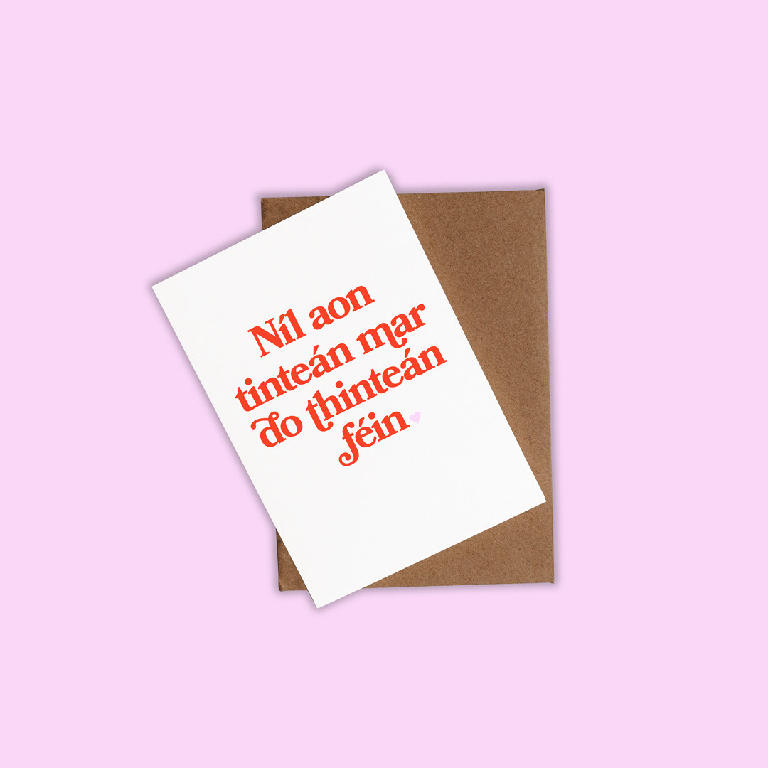 Greeting card featuring the Irish saying “Níl aon tinteán mar do thinteán féin,” styled as a minimalist stationery design.
