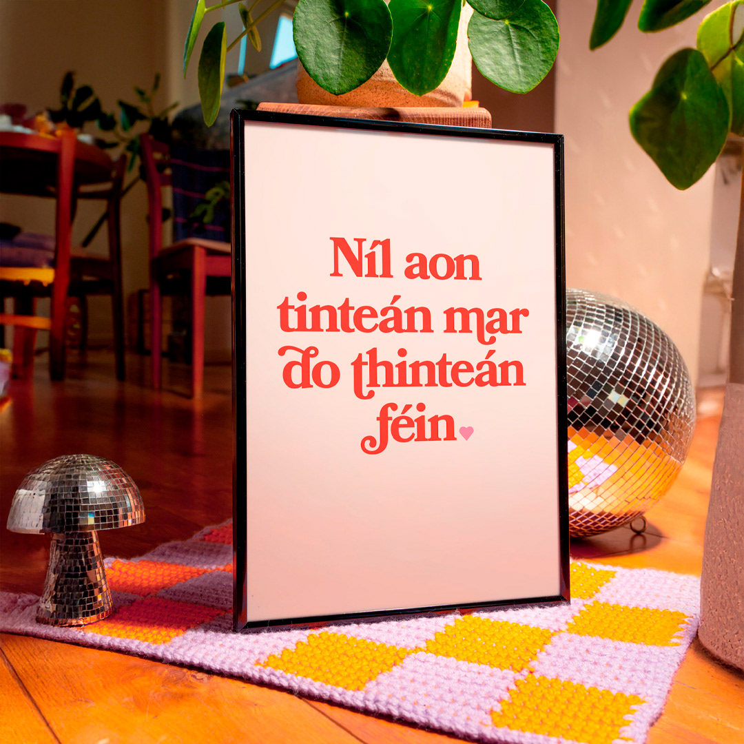 Framed Irish proverb art print mockup on a neutral wall, showcasing home decor potential.