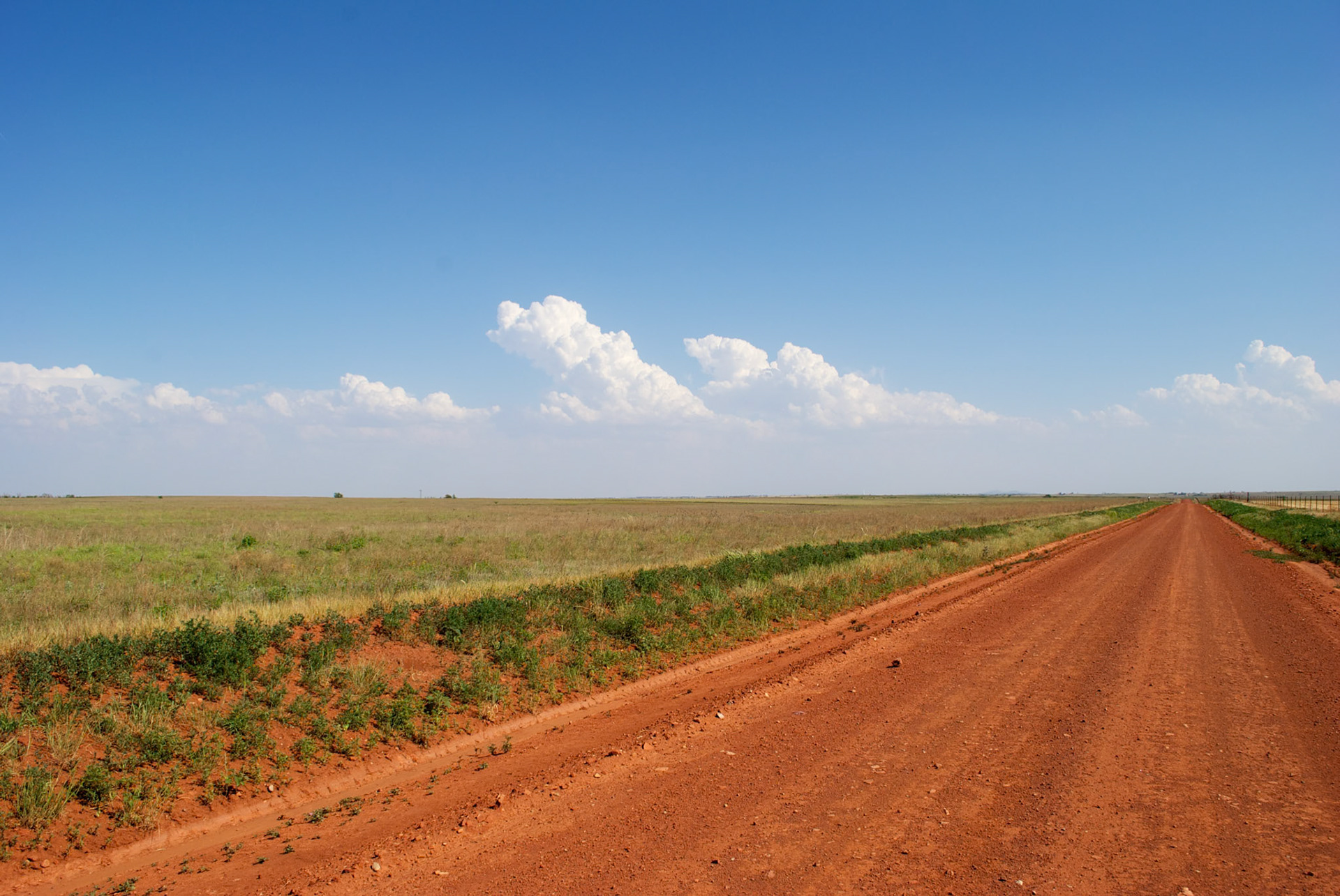 A wider view of the sheared cumulus clouds.