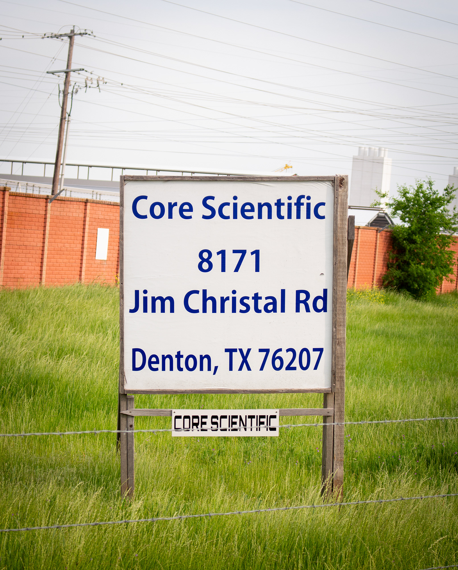 DENTON, TEXAS April 14, 2025  A sign noting the address of the Core Scientific data center construction site is posted at the front of the driveway in Denton, Texas. The Core Scientific data center will officially begin full computing operations in 2027. Photo/ Natalie VanDerWal