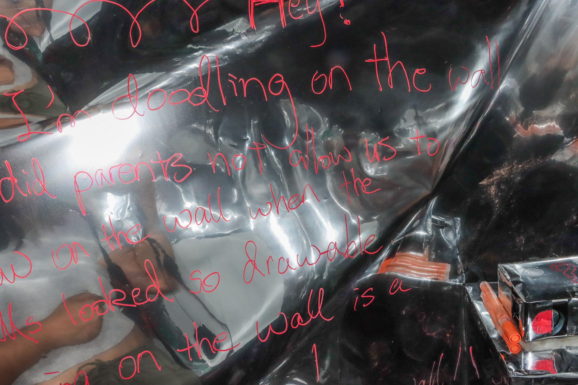 On the mylar sheet that's hanging