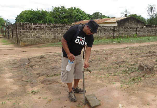 Checking water taps throughout the village