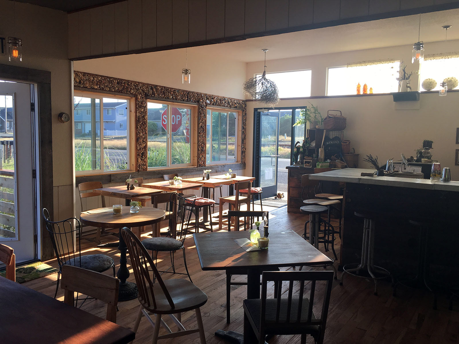 Light-filled Dining area with oak flooring and tap wall