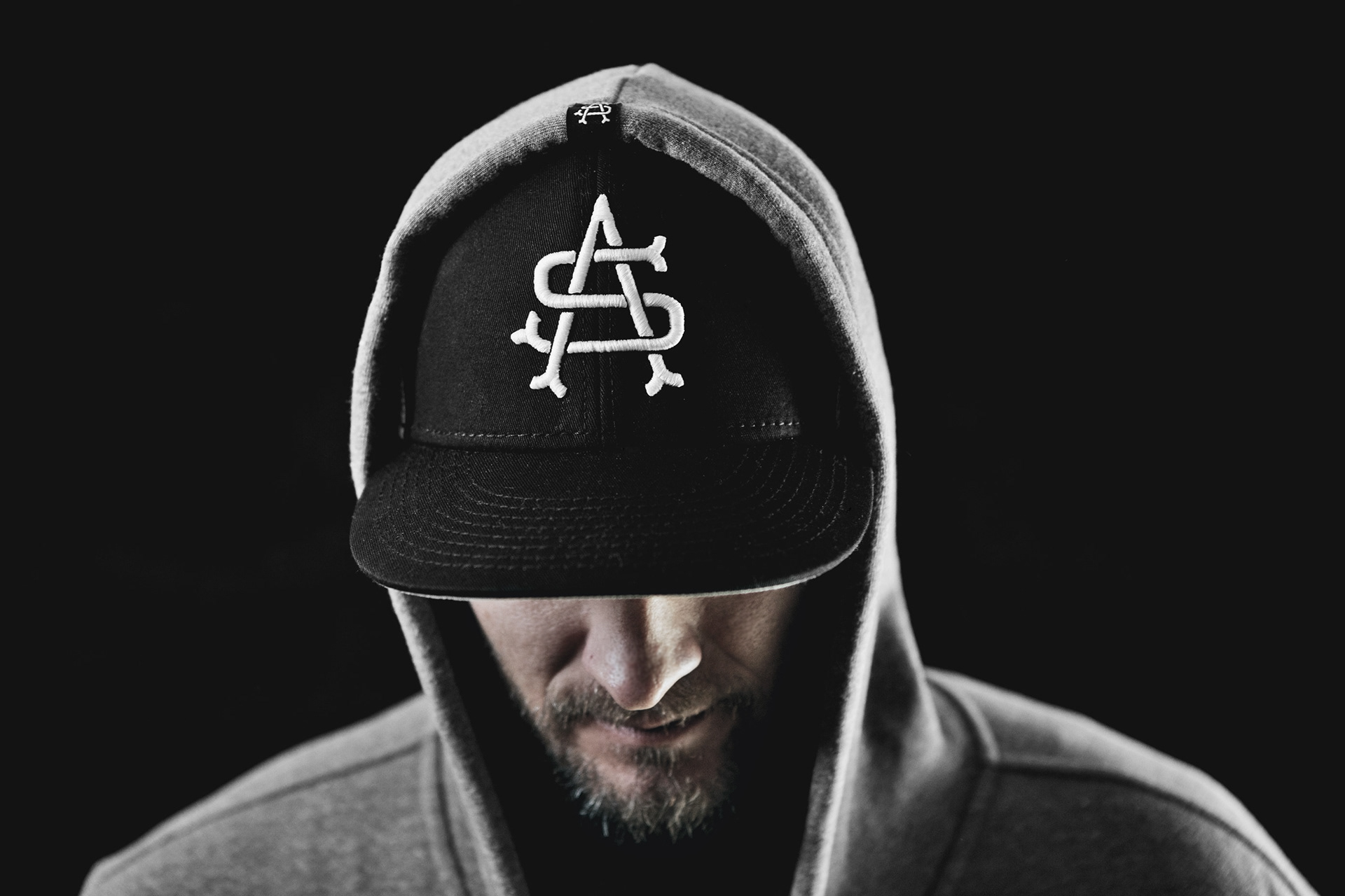 Monogram logo design embroidered hat and on hem tag