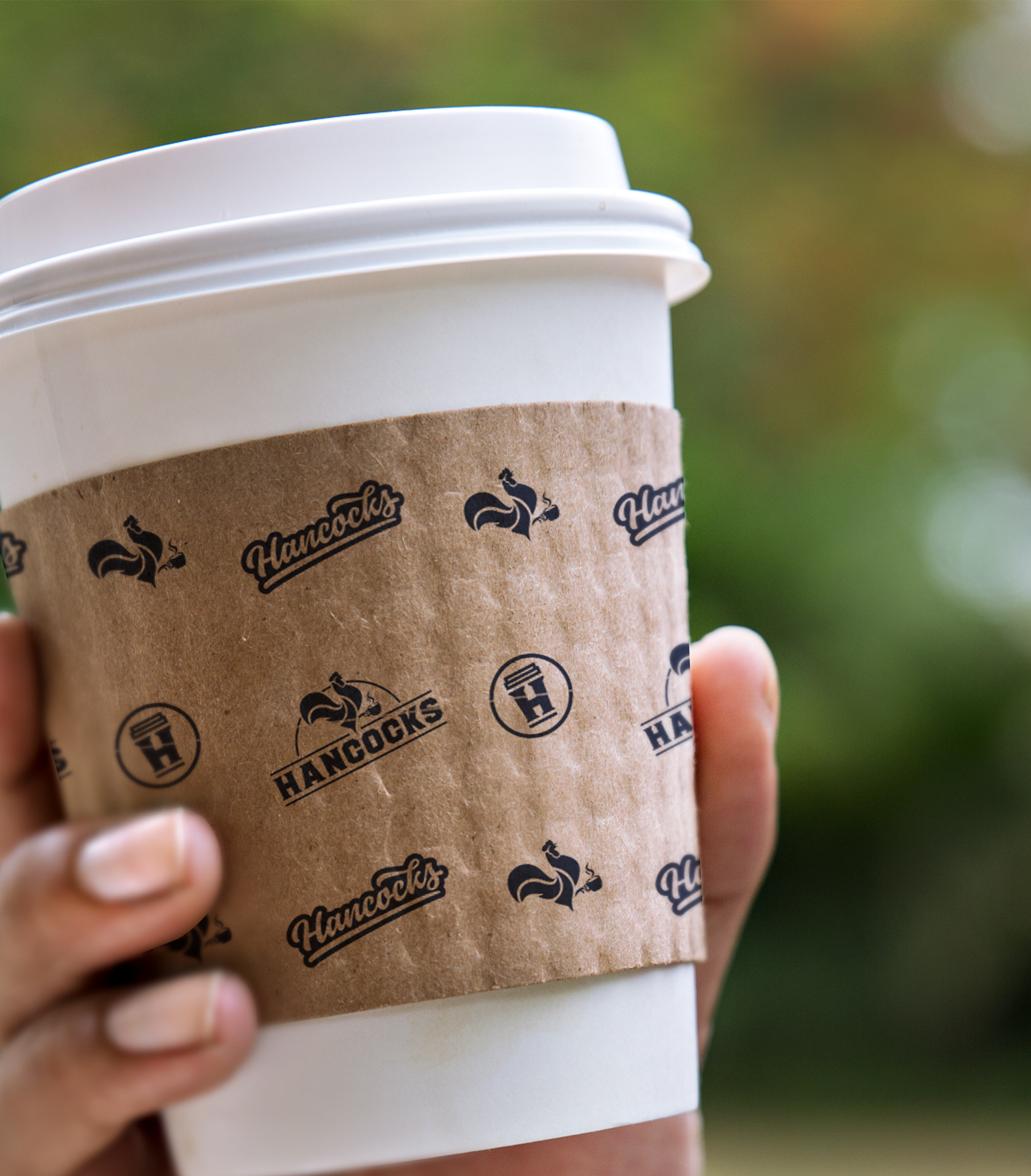 Hancocks Coffee House logo repeat on cup insulation