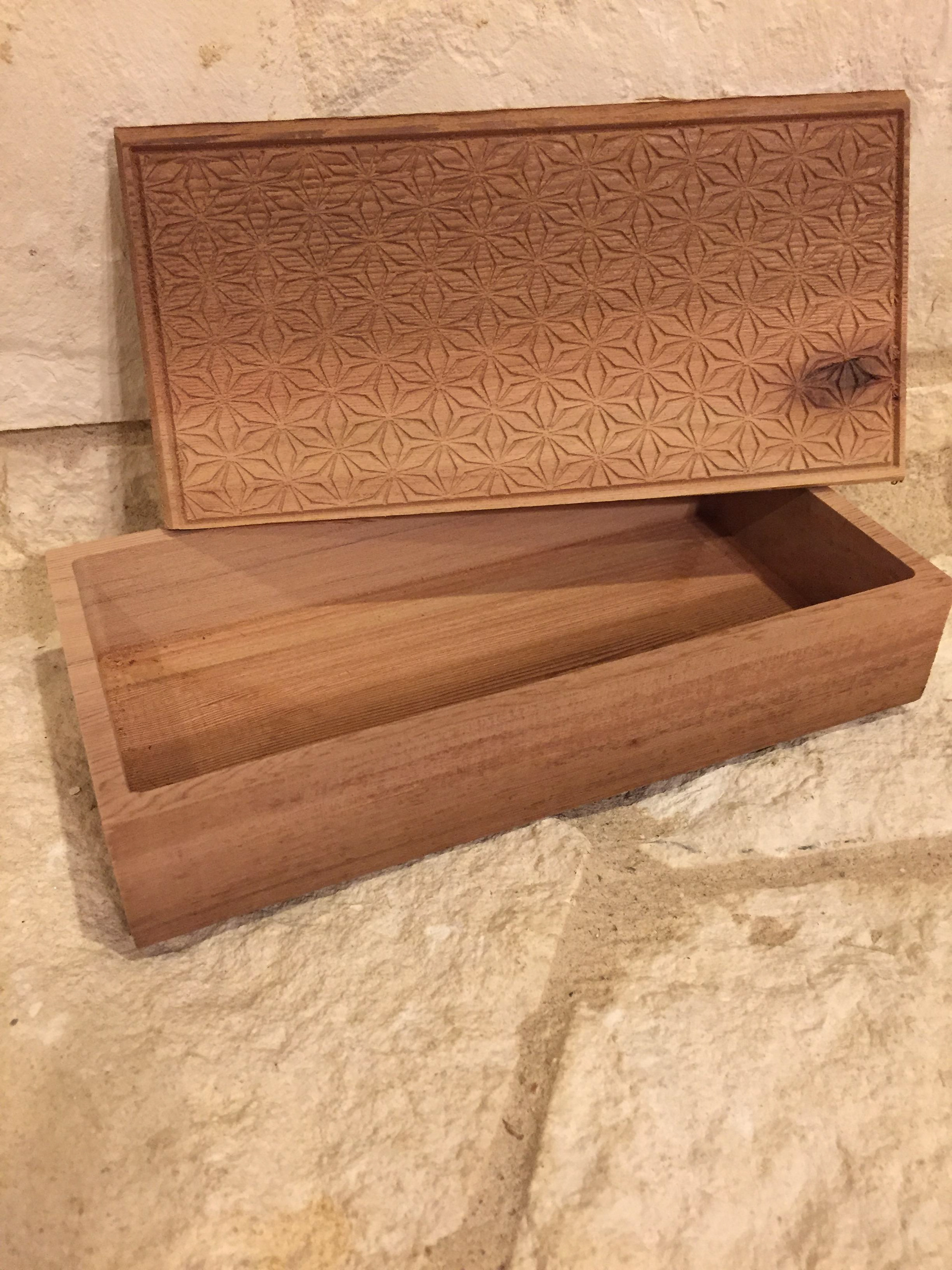 carved solid redwood with pattern carved into top of lid
