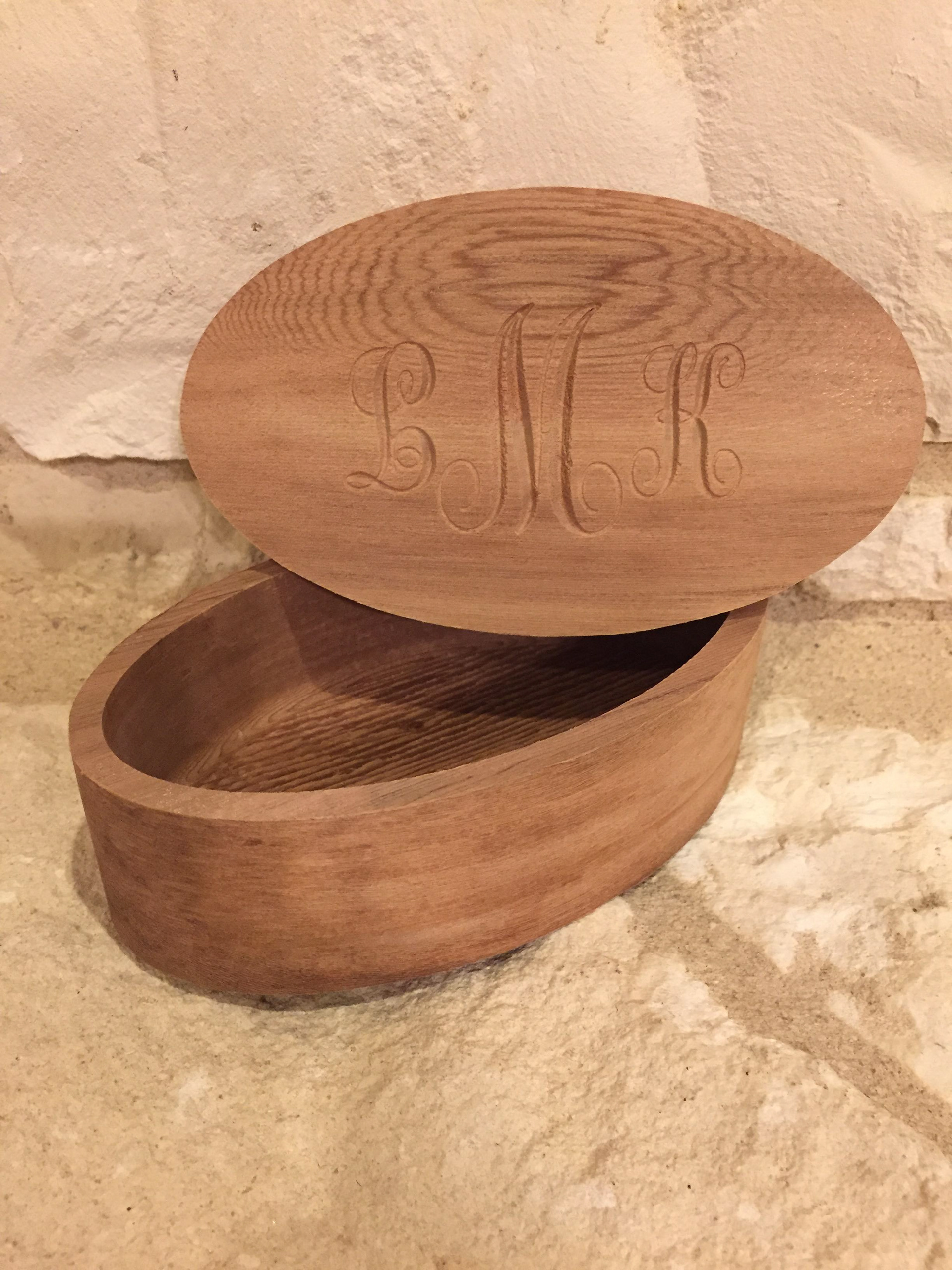 Carved solid redwood with carved lettering on domed lid
