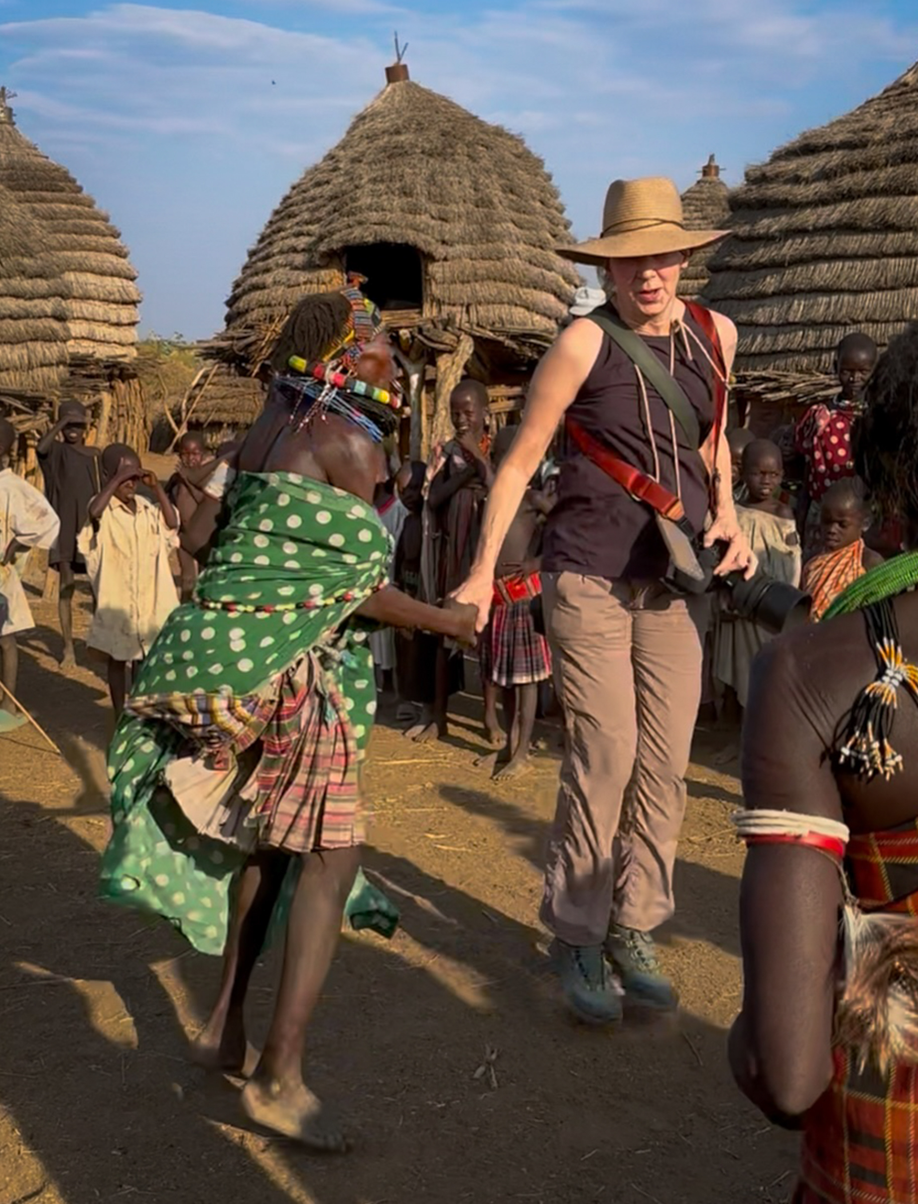Yes, that's me! This wonderful woman pulled me into the circle from the sidelines and I attempted to keep up with her....with 15lbs of camera gear hanging off of me!