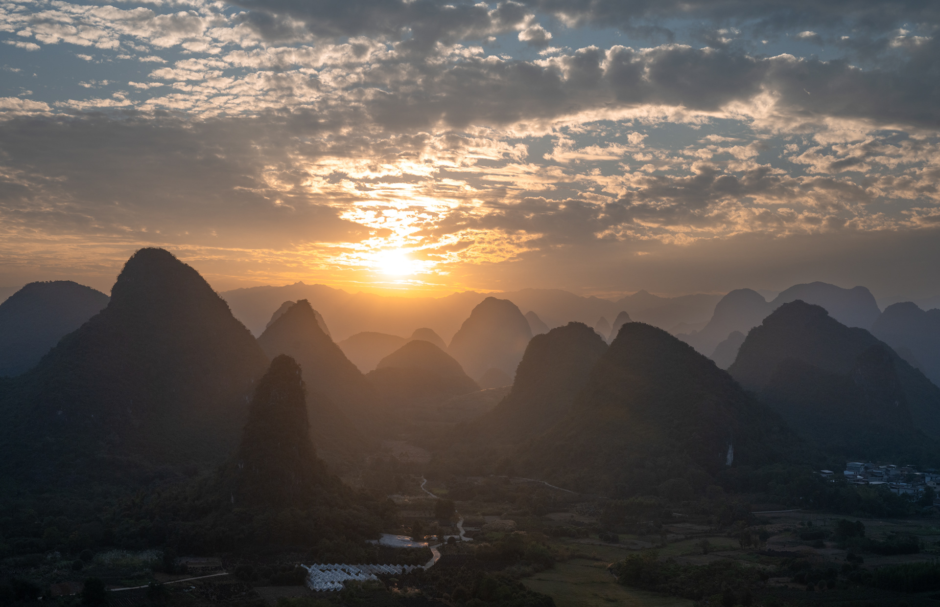 Limestone mountains in Guillin.  A consequemce of the collision of India and Asiia which formed the Hymalayas, The limestone was uplifted and exposed. 