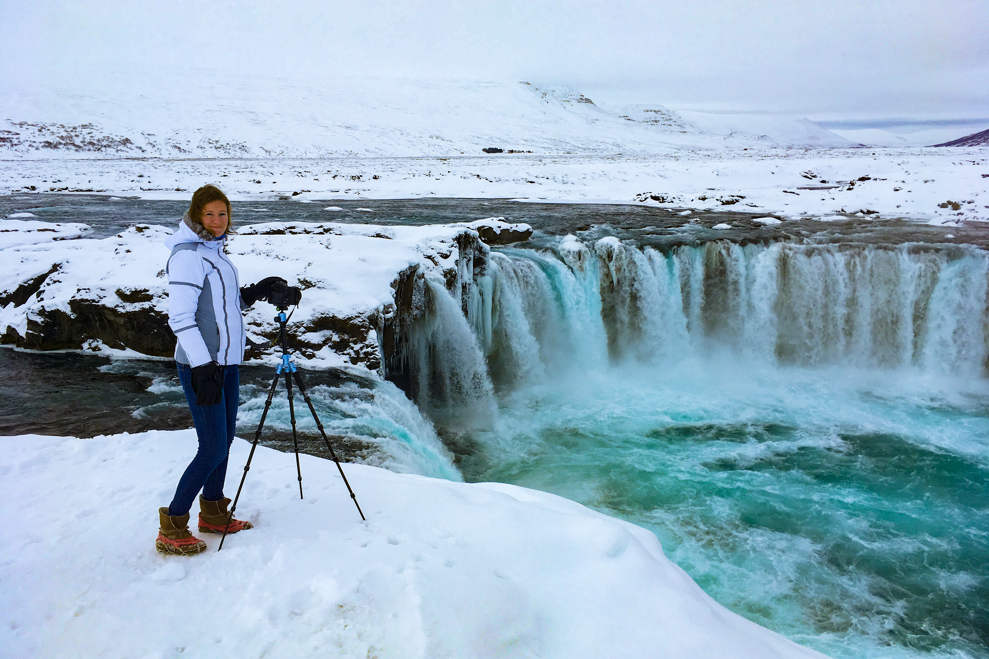 Enduring the cold during a long-exposure shoot of the Goðafoss Waterfall