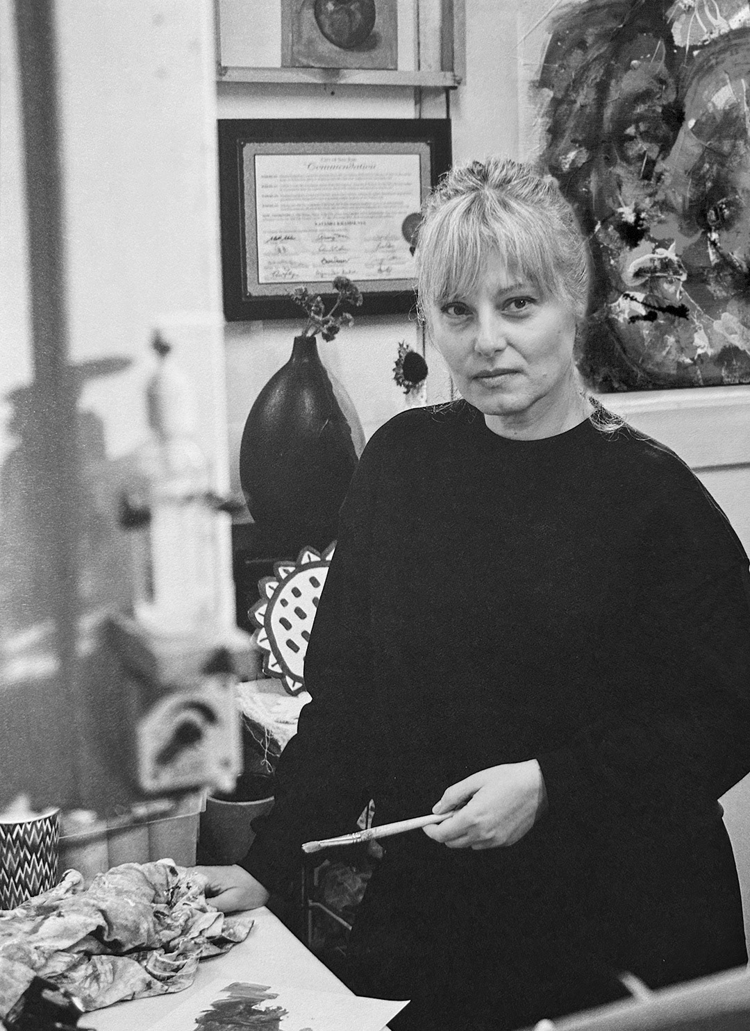 Bay Area Artist Natasha Kramskaya in front of her work in her studio, 2025