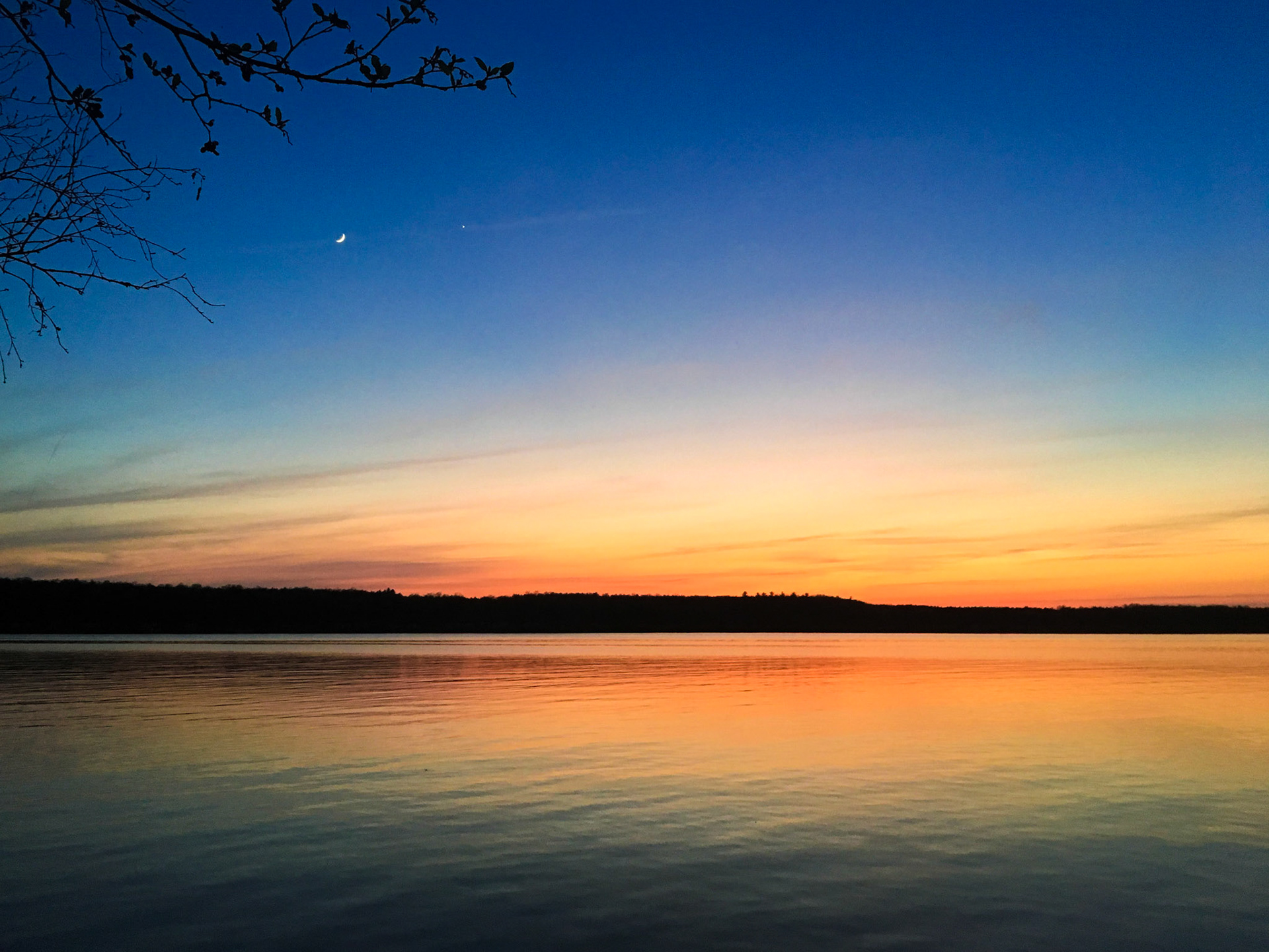 Crescent moon and Jupiter during sunset in Alcona Park, Alcona County, MI, 2018.