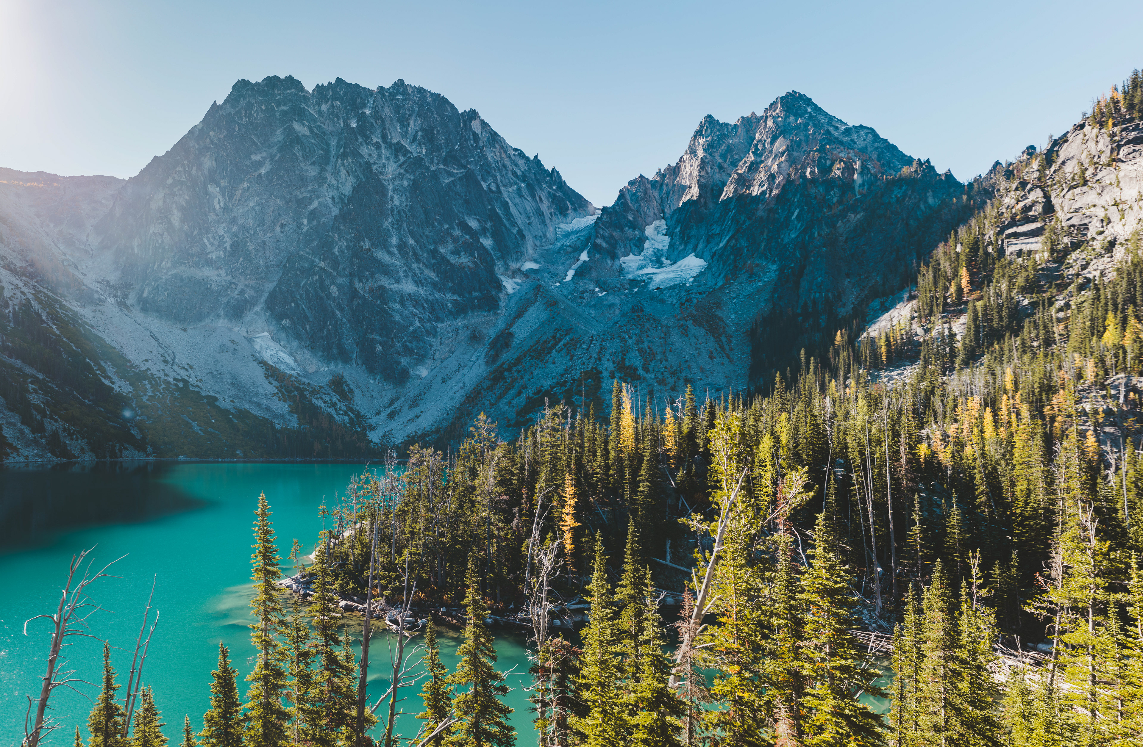 Photograph of Lake Colchuck in the Alpine Lakes Wilderness, Washington, with clear alpine water and surrounding granite peaks.