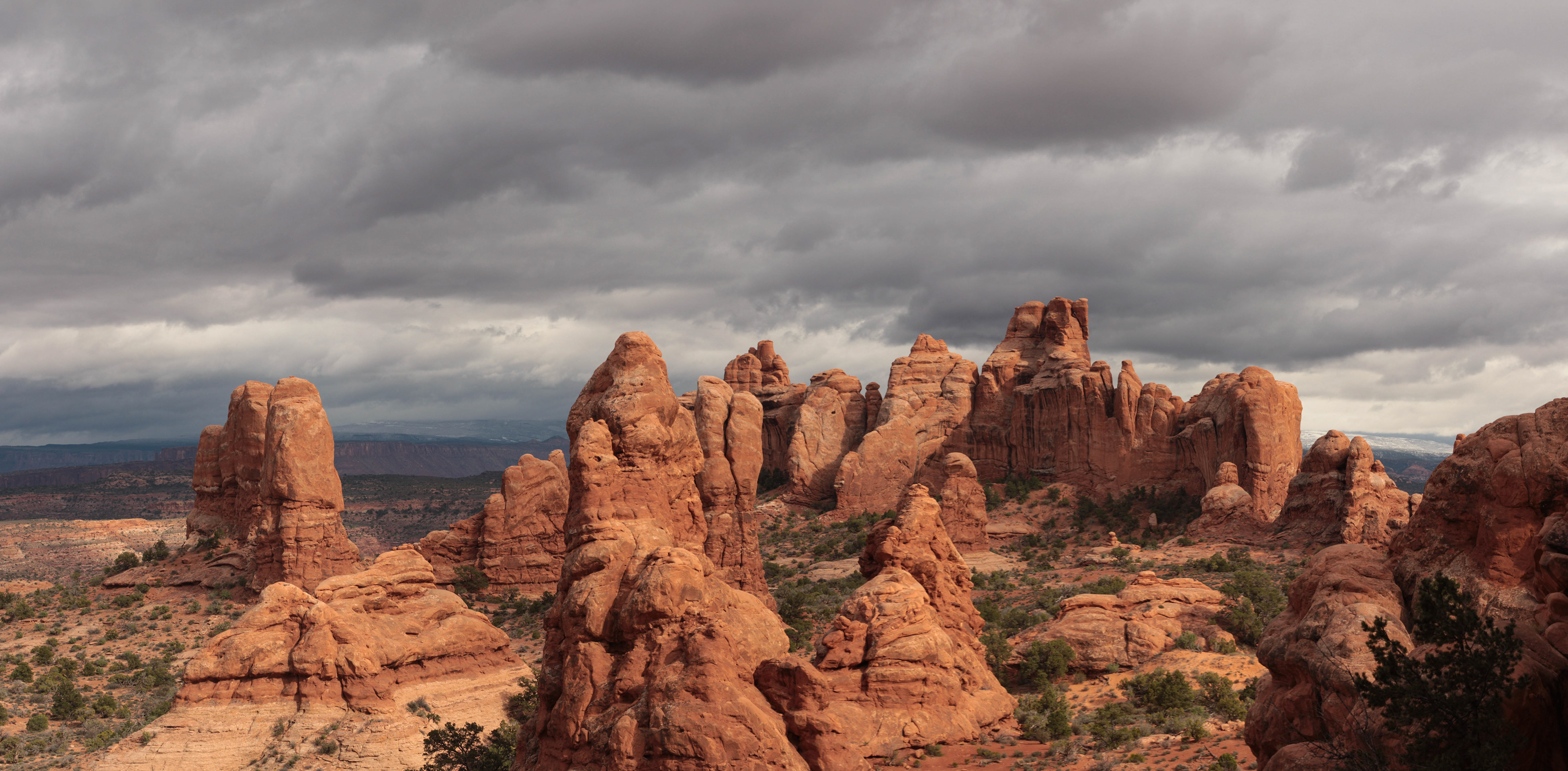Photograph of the Devils Garden Trail in Arches National Park, Utah, winding through sandstone fins and desert terrain.