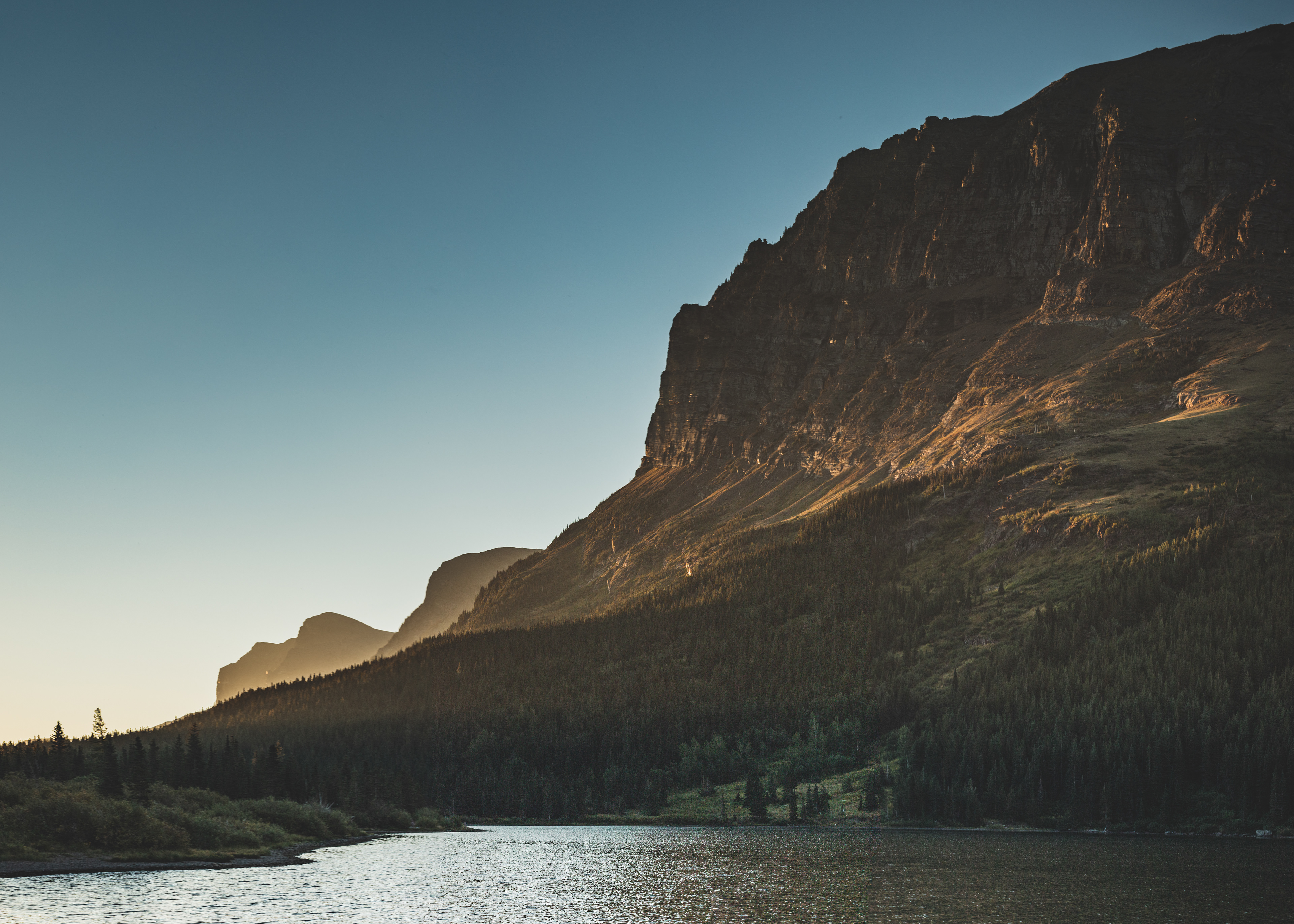 Photograph of Redrock Lake with Grinnell Point rising in the background, Glacier National Park