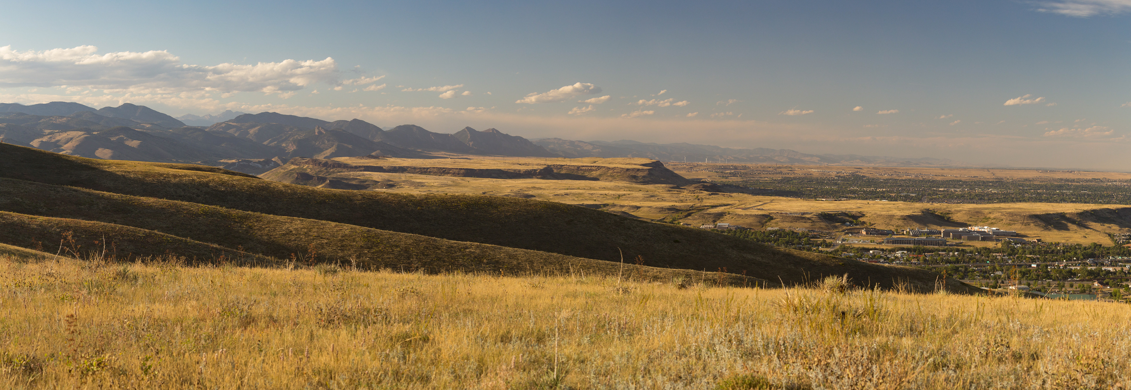 Photograph of South Table Mountain in Golden, Colorado, with basalt cliffs, open mesa terrain, and views across the Front Range foothills.