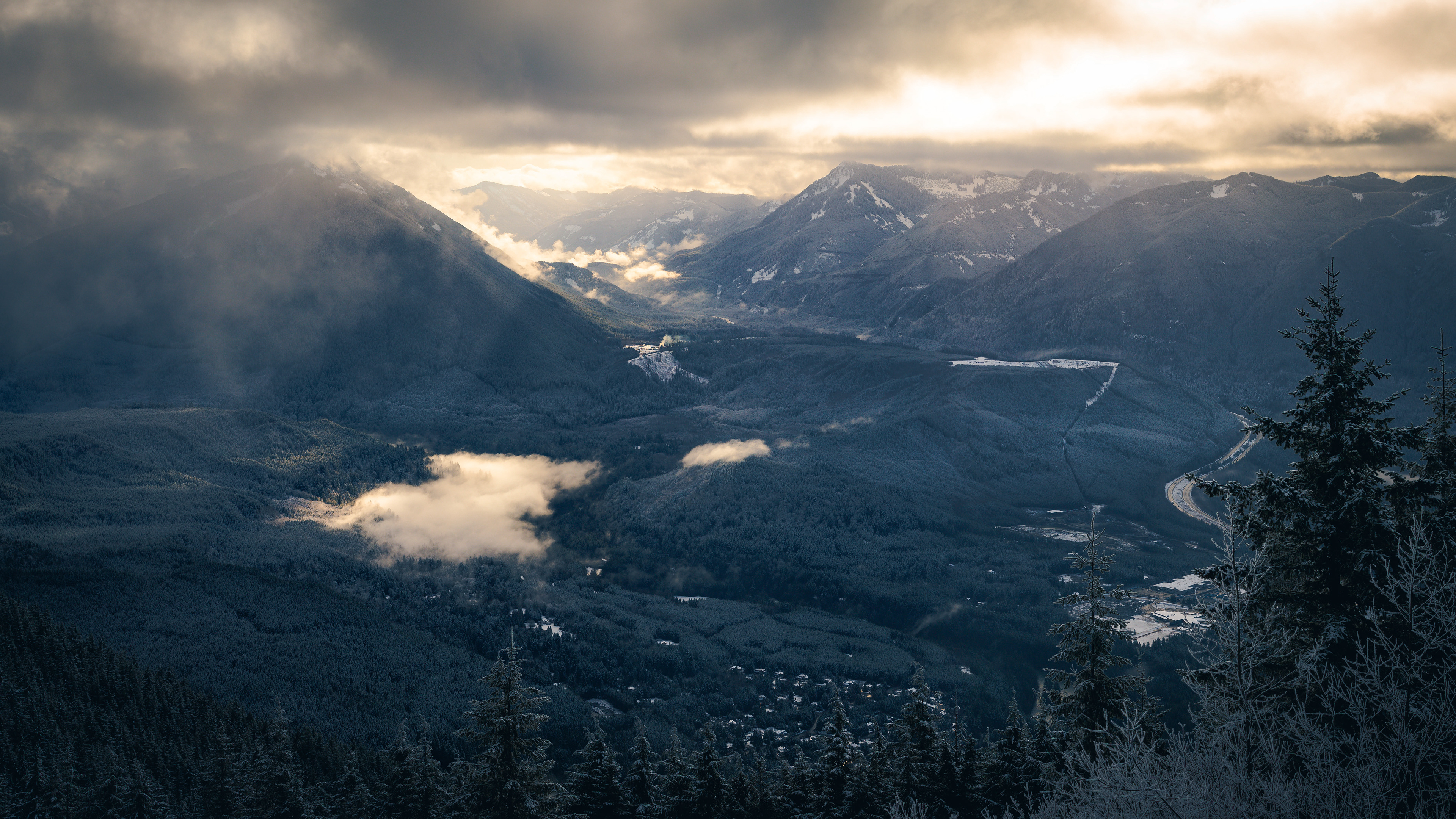 Photograph of the view from Little Si in the Mount Baker–Snoqualmie National Forest, Washington, with forested foothills and layered Cascade ridgelines.