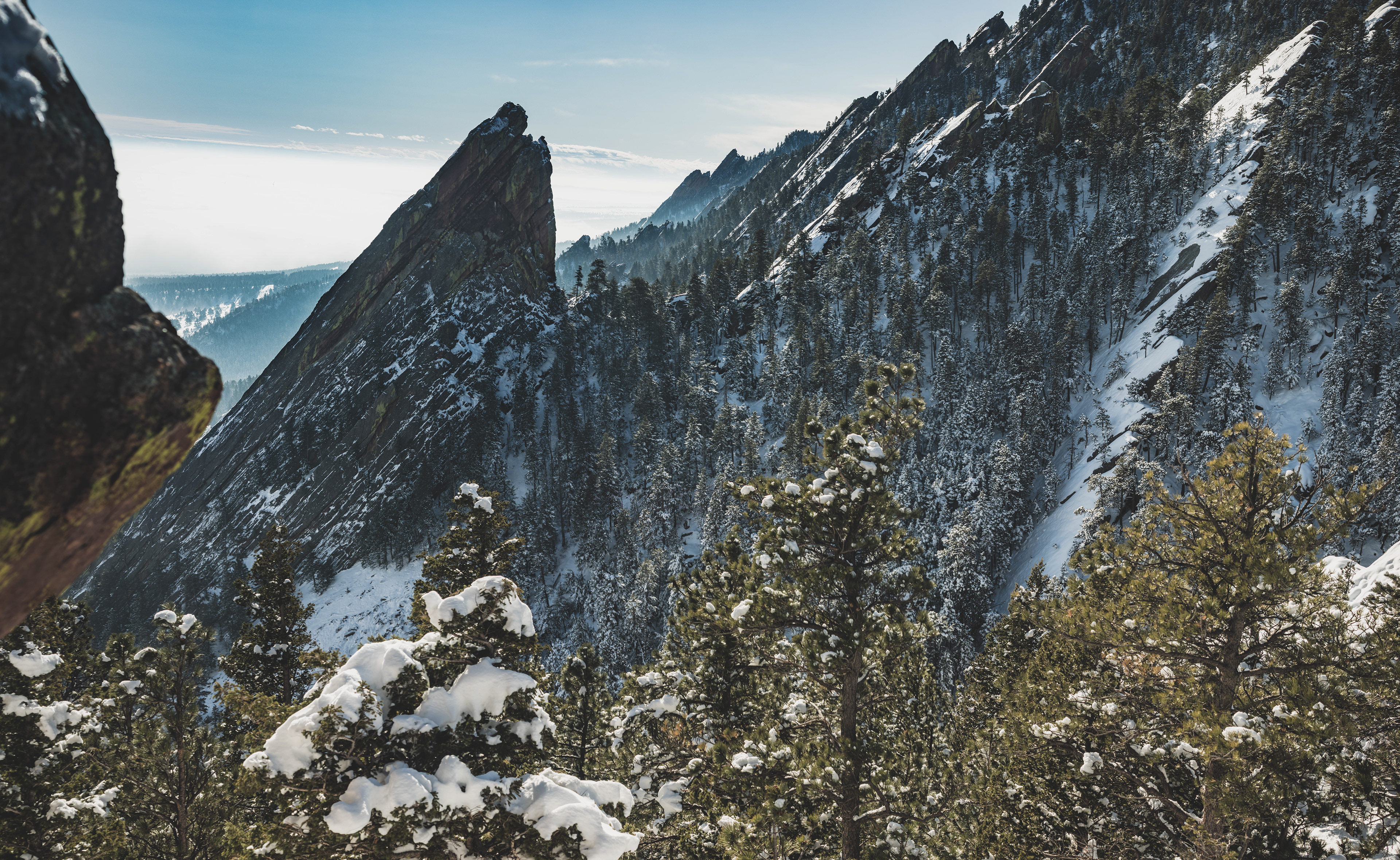 Photograph of the Third Flatiron in Boulder, Colorado, with steep sandstone slabs and dramatic Front Range terrain.