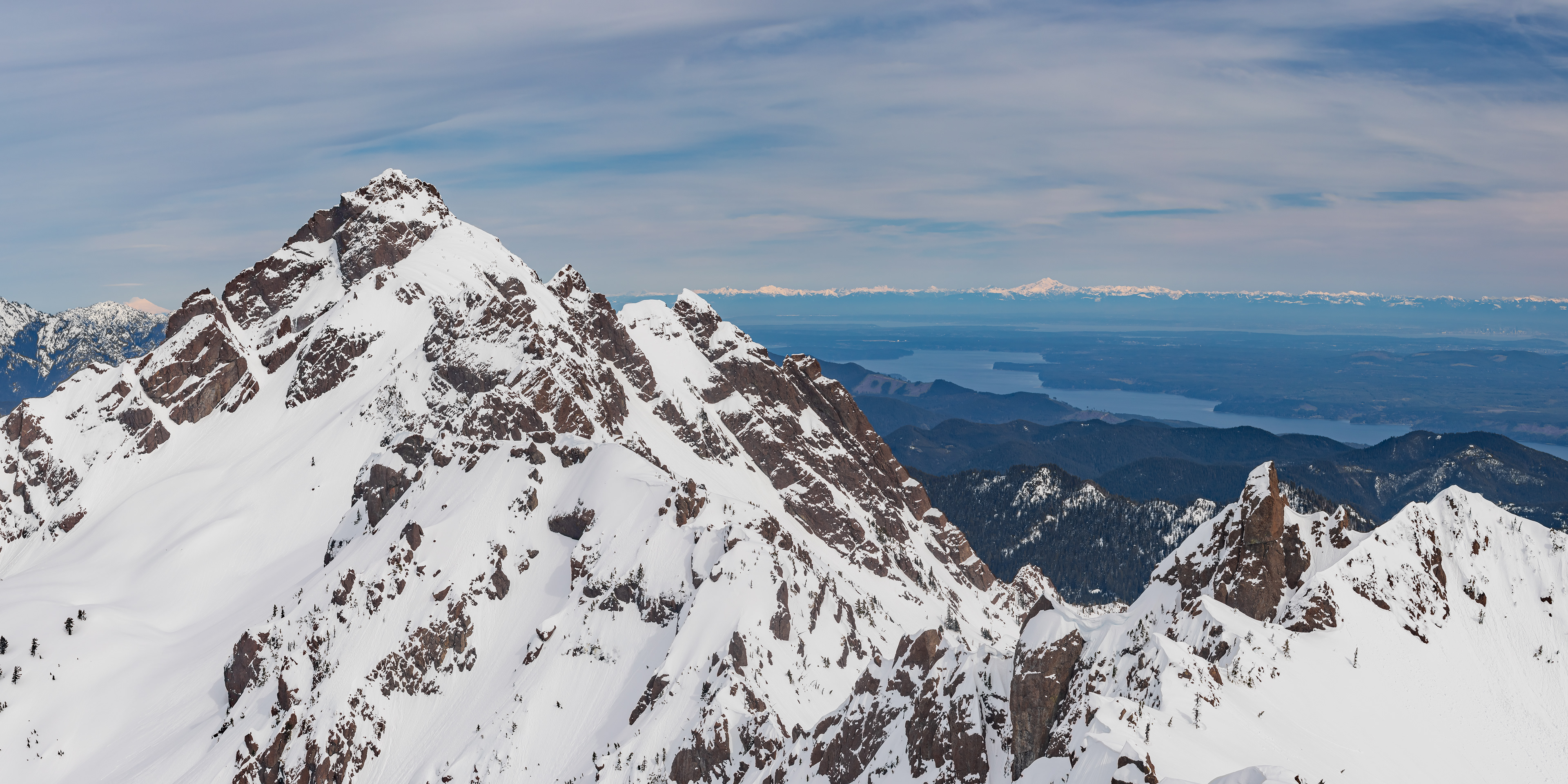 Photograph of the view from Mount Ellinor in Olympic National Forest, Washington, with sweeping mountain vistas and layered ridgelines.
