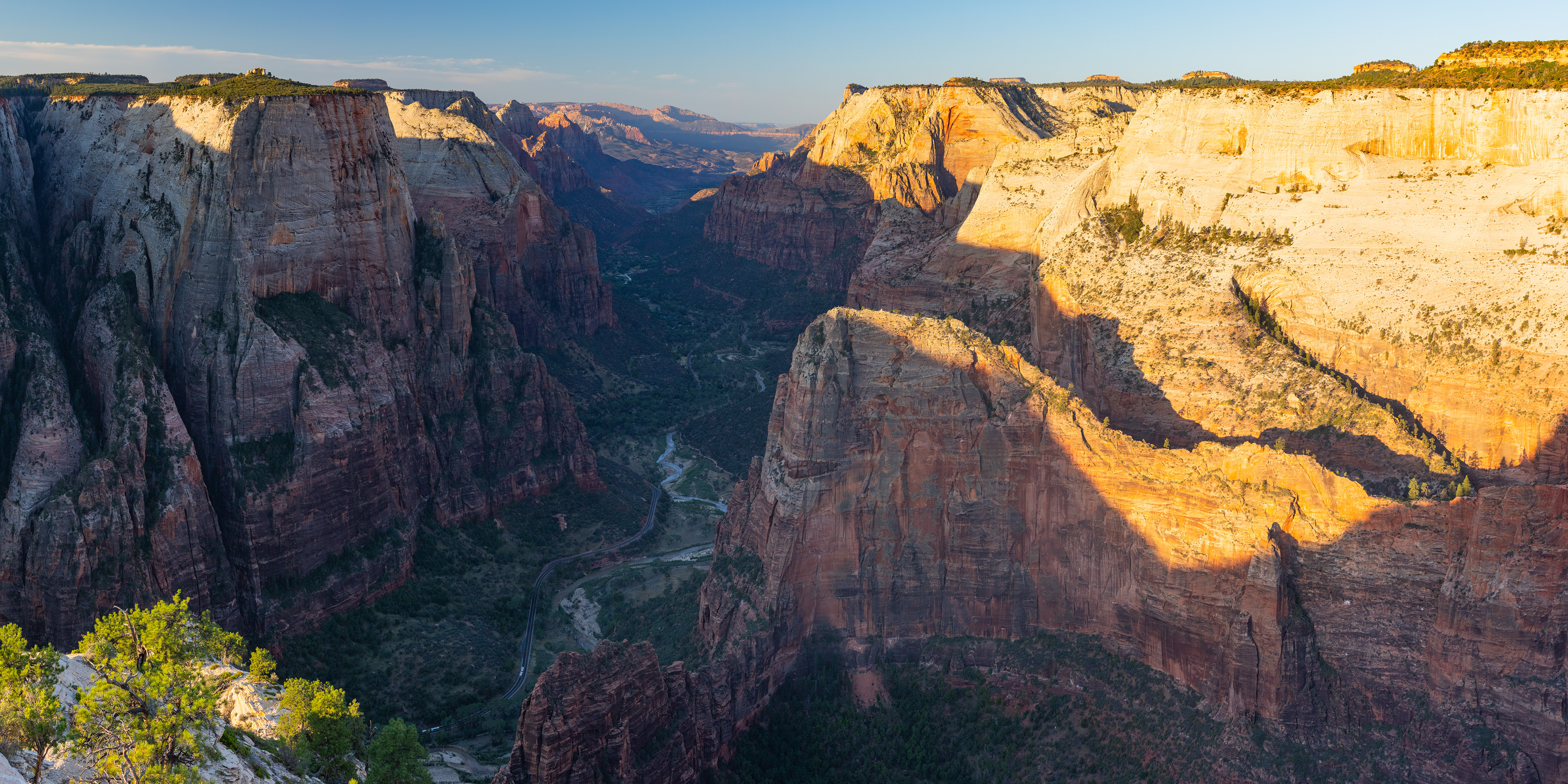 Photograph of Angels Landing viewed from Observation Point in Zion National Park, Utah, with steep sandstone cliffs and sweeping canyon views.