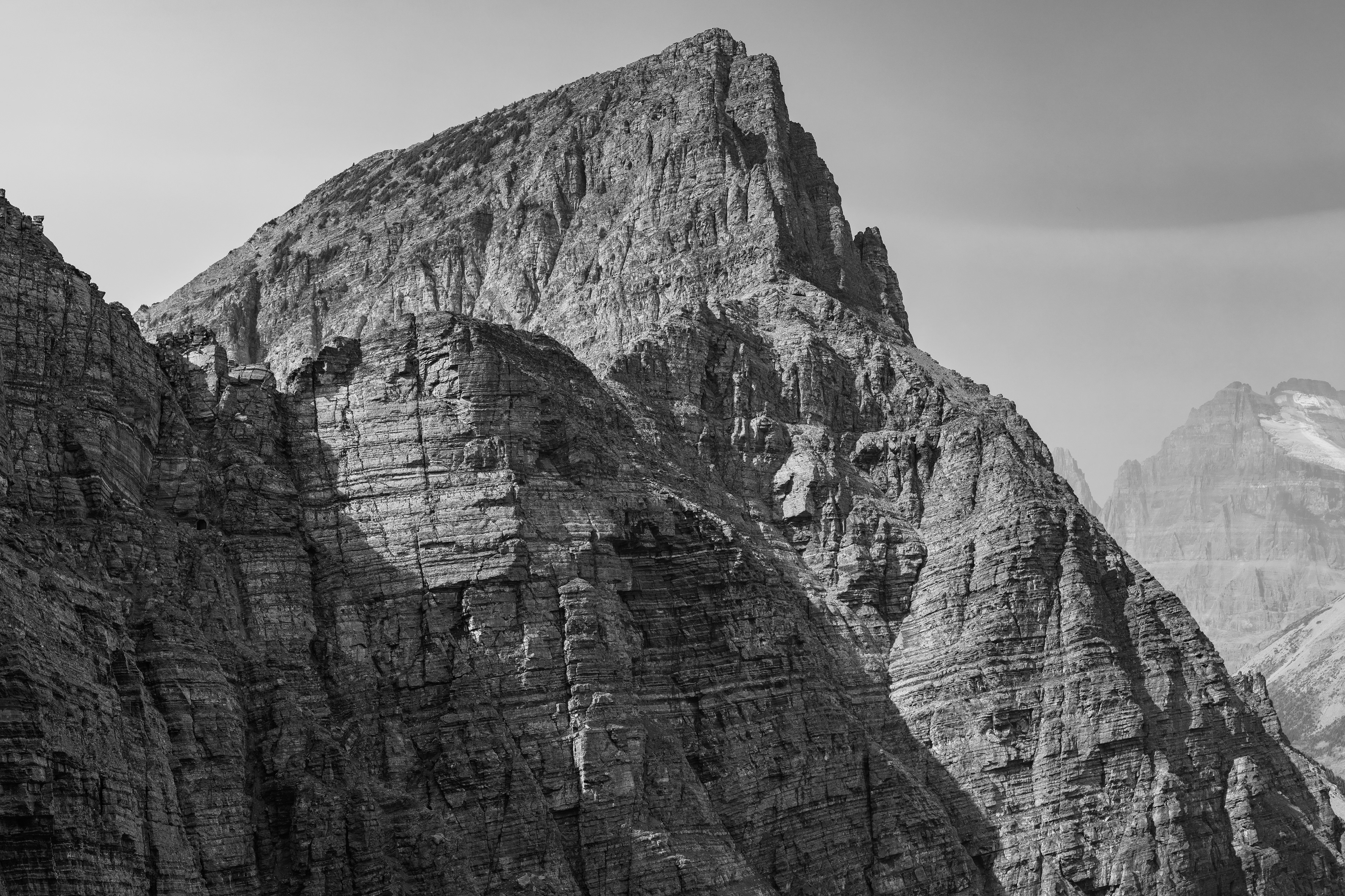 Black and white photograph of the Ptarmigan Wall, Glacier National Park
